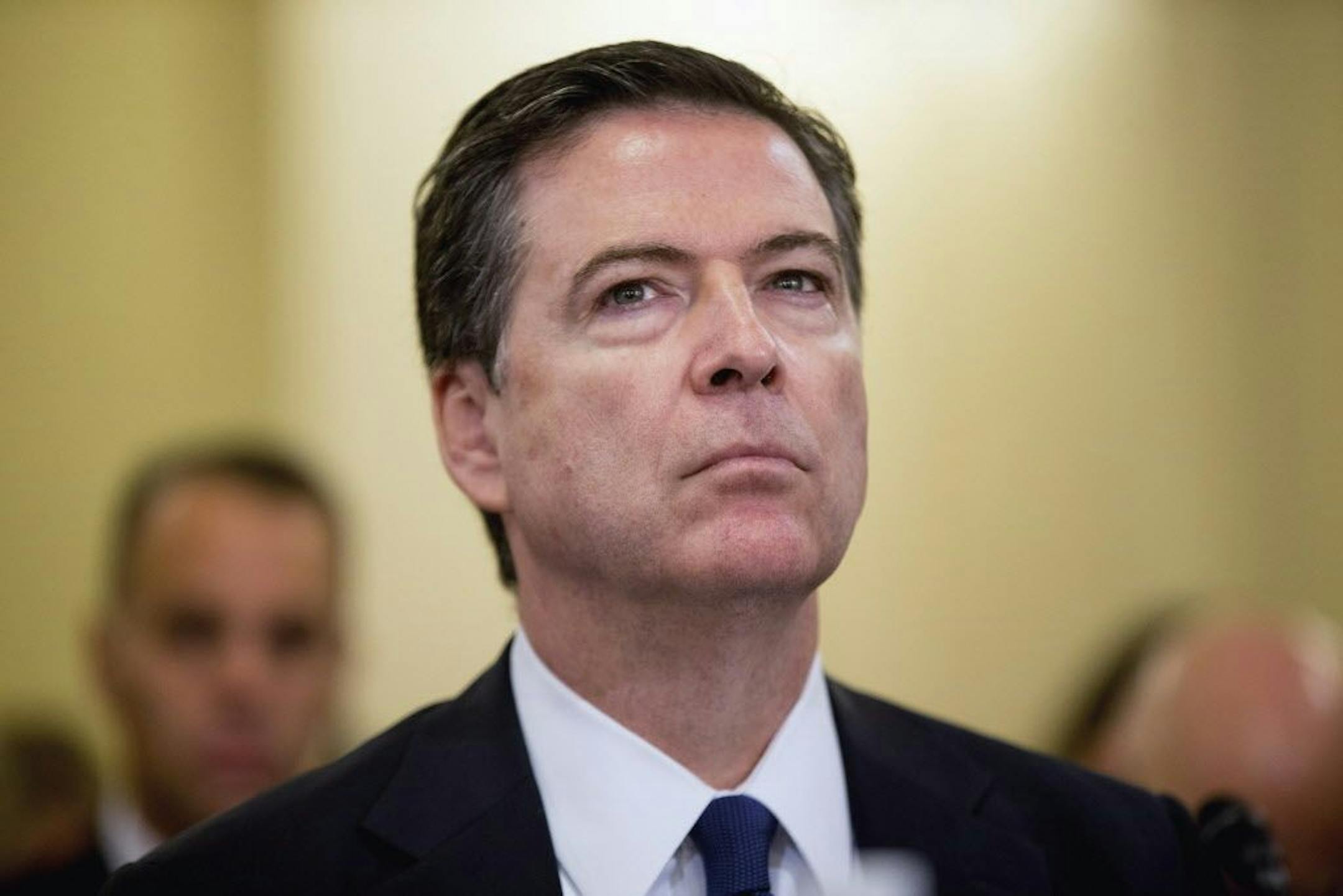 FILE - In this Oct. 21, 2015, file photo, FBI Director James Comey listens while testifying on Capitol Hill in Washington. Violent crime has often been a local government concern and a problem that had been on the decline. But rising homicide totals in most of America�s large cities have raised alarms within the Obama administration. Comey says the "very disturbing" homicide spike has law enforcement scrambling to figure out why it�s happening now, and why in so many cities that seemingly have l