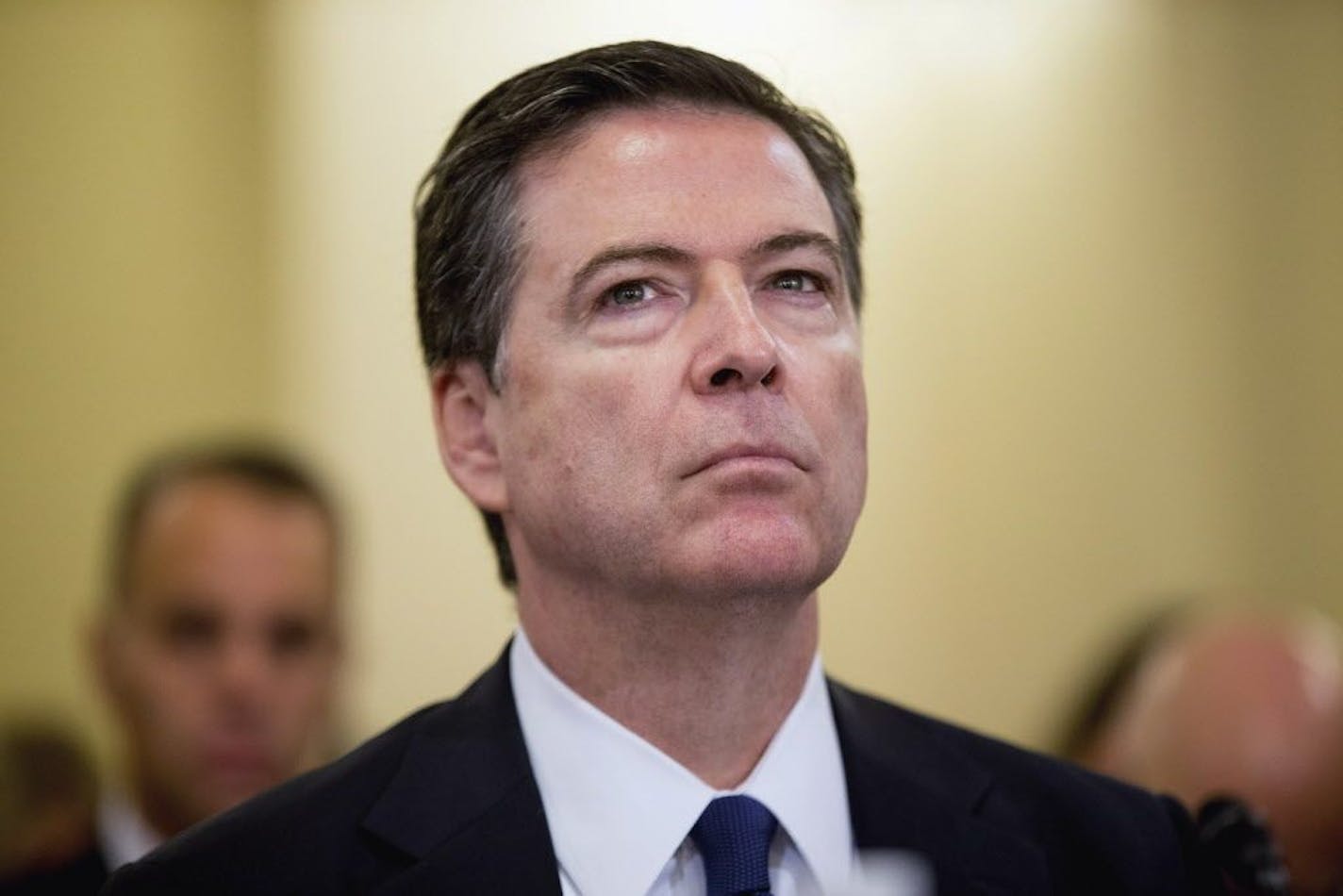 FILE - In this Oct. 21, 2015, file photo, FBI Director James Comey listens while testifying on Capitol Hill in Washington. Violent crime has often been a local government concern and a problem that had been on the decline. But rising homicide totals in most of America�s large cities have raised alarms within the Obama administration. Comey says the "very disturbing" homicide spike has law enforcement scrambling to figure out why it�s happening now, and why in so many cities that seemingly have l