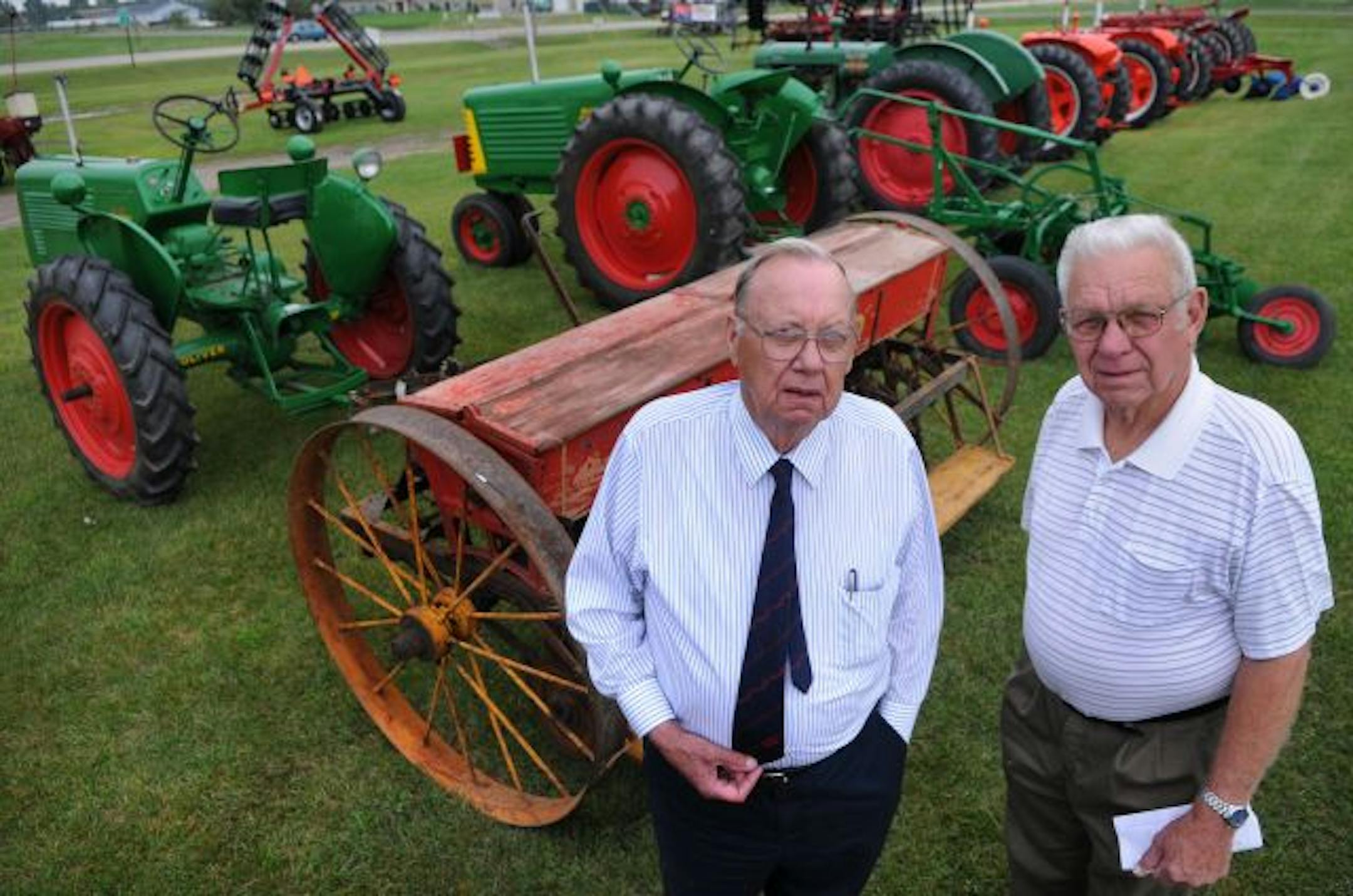 Harvey Greenberg, 77, and Don Greenberg, 84, with some of the antique tractors they will be showing in the annual Nowthen Theshing Show. Harvey Greenberg grew up in what is now Nowthen and started driving tractors at age 13. "I liked to drive tractors. I was tractor crazy," he said.