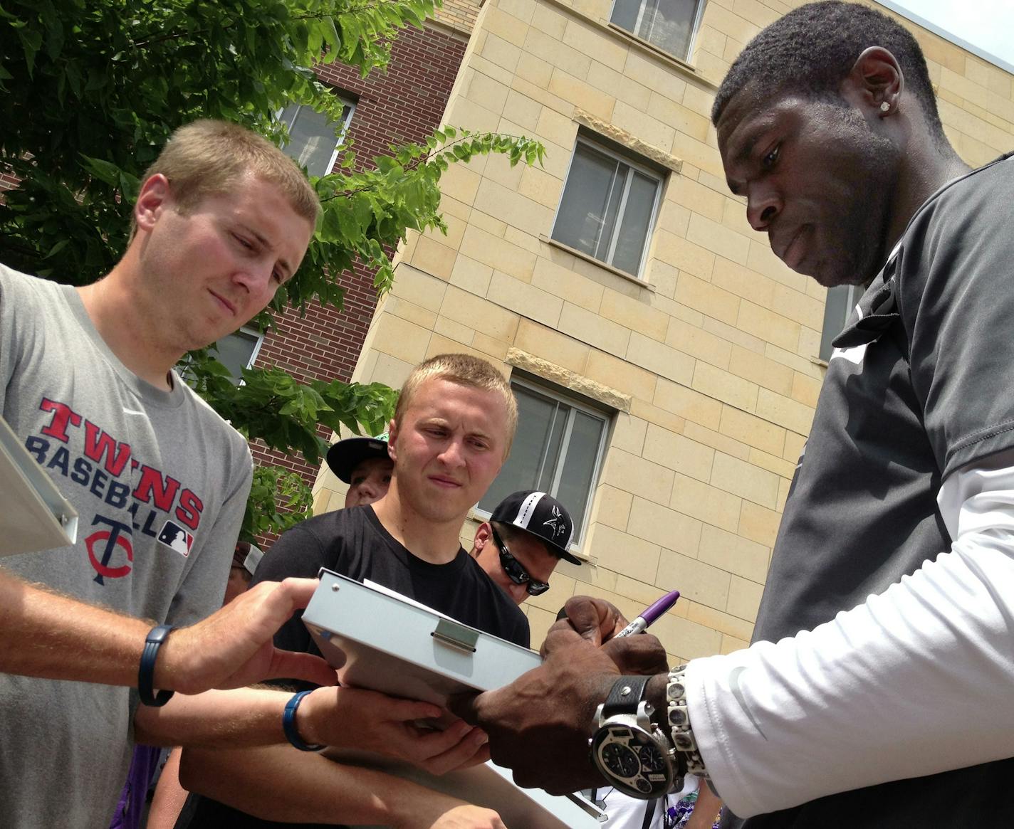 LaMark Brown, Minnesota Vikings tight end, signs autographs on Thursday in Mankato, as the team reports for training camp. ] Carlos Gonzalez/Star Tribune