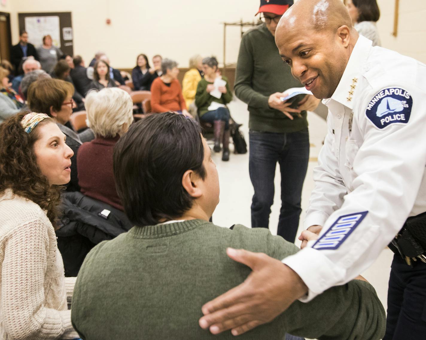 Chief Medaria Arradondo, right, greets Jenelle, left, and Ryan Masterson before the community event. ] LEILA NAVIDI &#xef; leila.navidi@startribune.com BACKGROUND INFORMATION: Minneapolis Police Chief Medaria Arradondo attends a community discussion and Q&A session with Minneapolis Police 5th Precinct inspector Kathy Waite presented by Minneapolis City Council member Linea Palmisano at Pershing Park in Minneapolis on Monday, February 26, 2018.