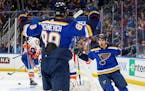 St. Louis Blues' Jordan Kyrou (25) cheers after Pavel Buchnevich (89) scored his second goal, during the second period against the New York Islanders.