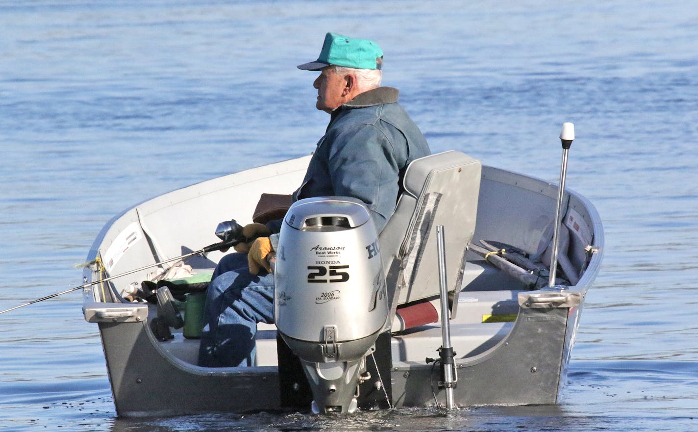 A lone angler tries his luck on Opening Day, jigging for walleyes on Lake Vermilion's Pike Bay. As temperatures climbled out of morning lows in the high 20s, the fishing improved into the afternoon. Bluebird skies, light winds and the tradition of fishing the opener drew a large crowd to the eastern half of Lake Vermilion by Tower