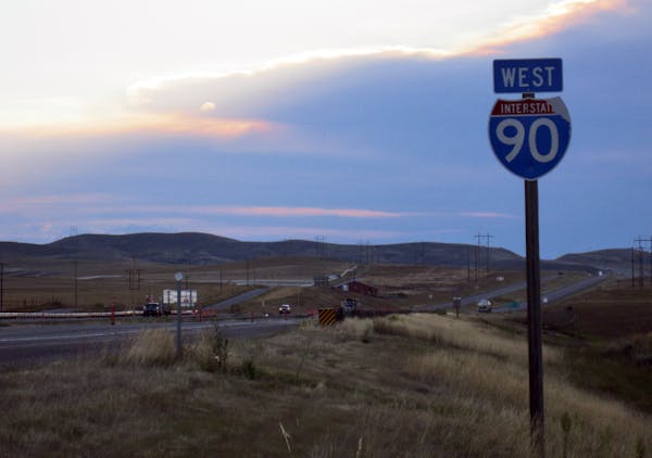 An evening storm approached on Interstate 90 in Montana during the author&#x2019;s weeklong hitchhiking adventure.