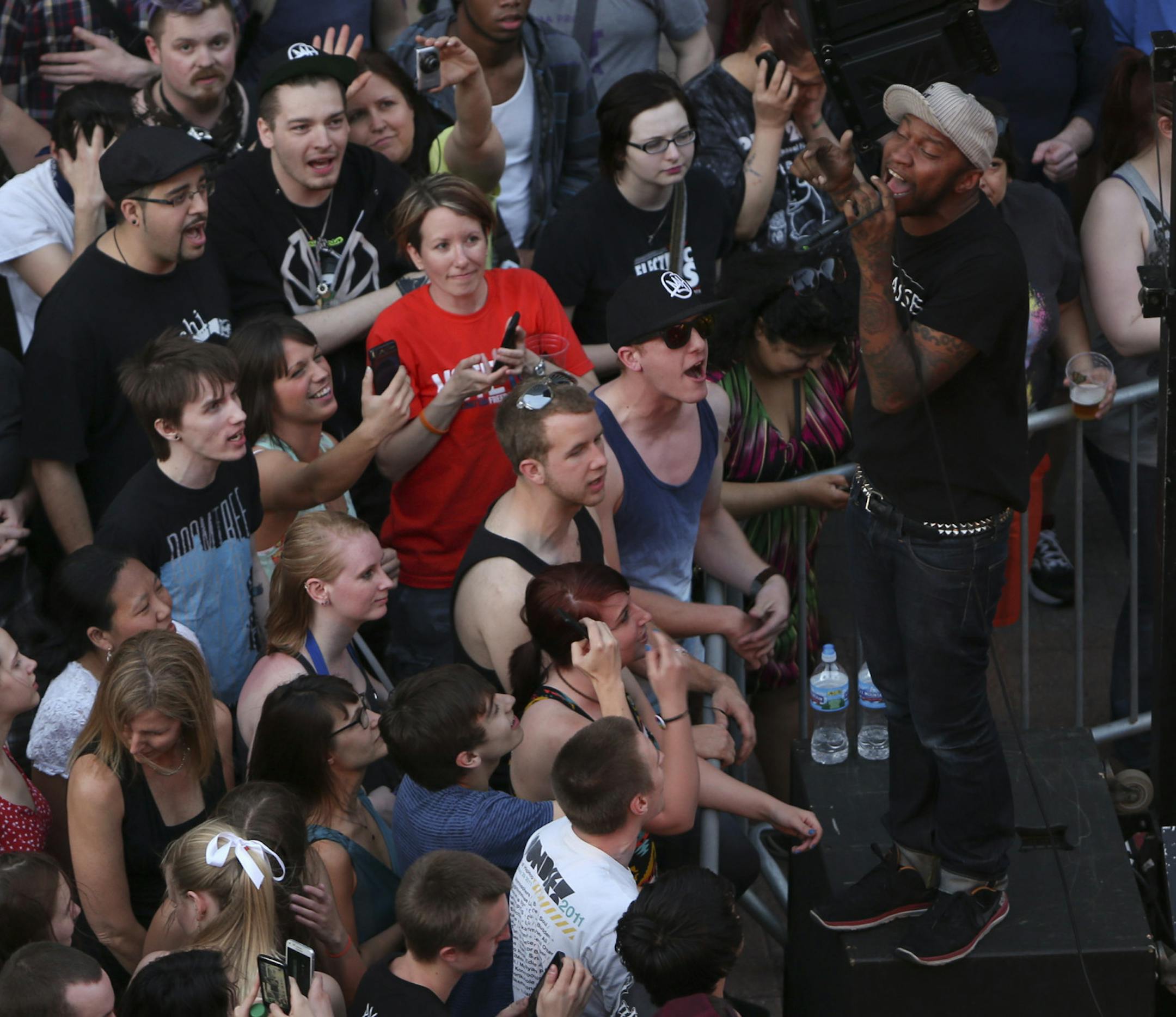 The City of St. Paul hosted a "Love is Law" outdoor musical celebration Tuesday evening, May 14, 2013 to commemorate the signing of the historic marriage bill. The rapper P.O.S. got the crowd fired up during his set on the Ecolab Plaza Tuesday night. ] JEFF WHEELER &#x201a;&#xc4;&#xa2; jeff.wheeler@startribune.com ORG XMIT: MIN1305142103080140