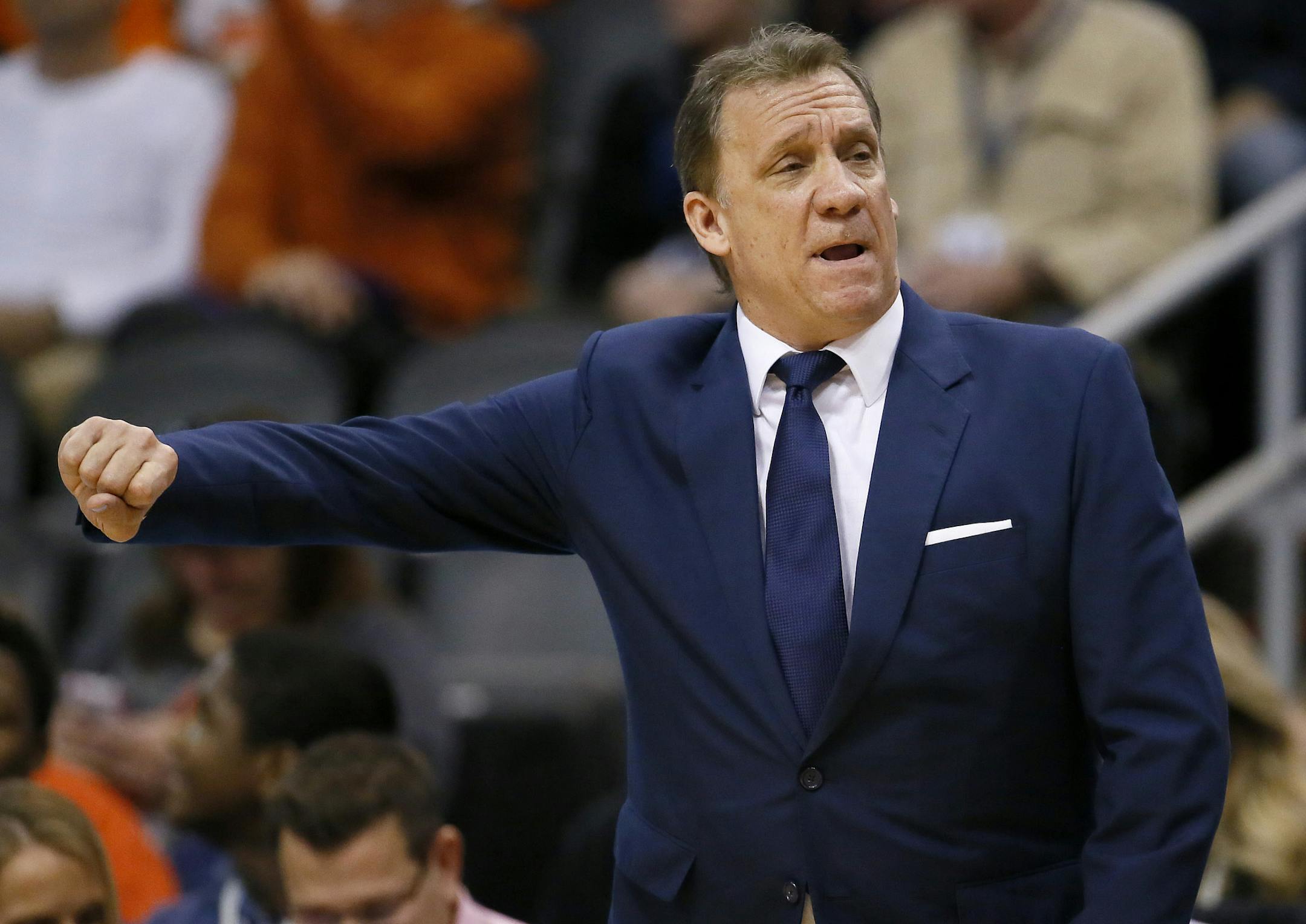 Minnesota Timberwolves head coach Flip Saunders motions to his team during the first half of an NBA basketball game against the Phoenix Suns, Friday, Jan. 16, 2015, in Phoenix. (AP Photo/Matt York)