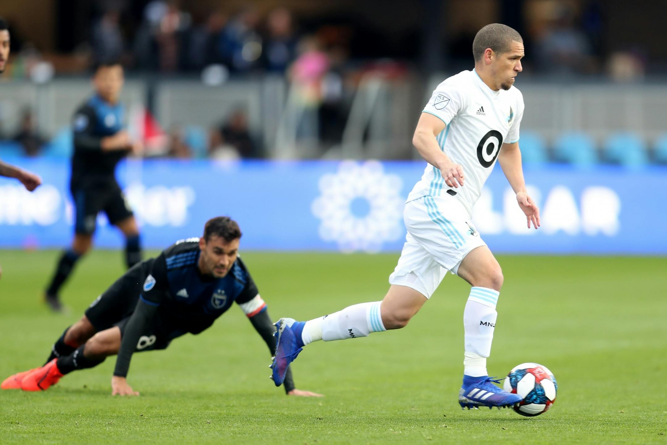 SAN JOSE, CALIFORNIA - MARCH 9: Minnesota United's Osvaldo Alonso (6) dribbles past San Jose Earthquakes' Chris Wondolowski (8) during the first half of a MLB game at Avaya Stadium in San Jose, Calif., on Saturday, March 9, 2019.