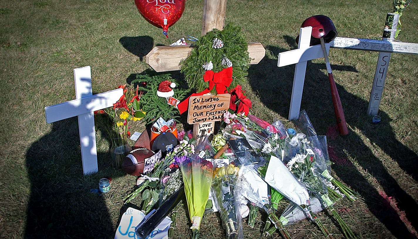 Lakeville South High School senior Soda Simphilavong pays his respects at the site of the Lakeville crash that killed two students.