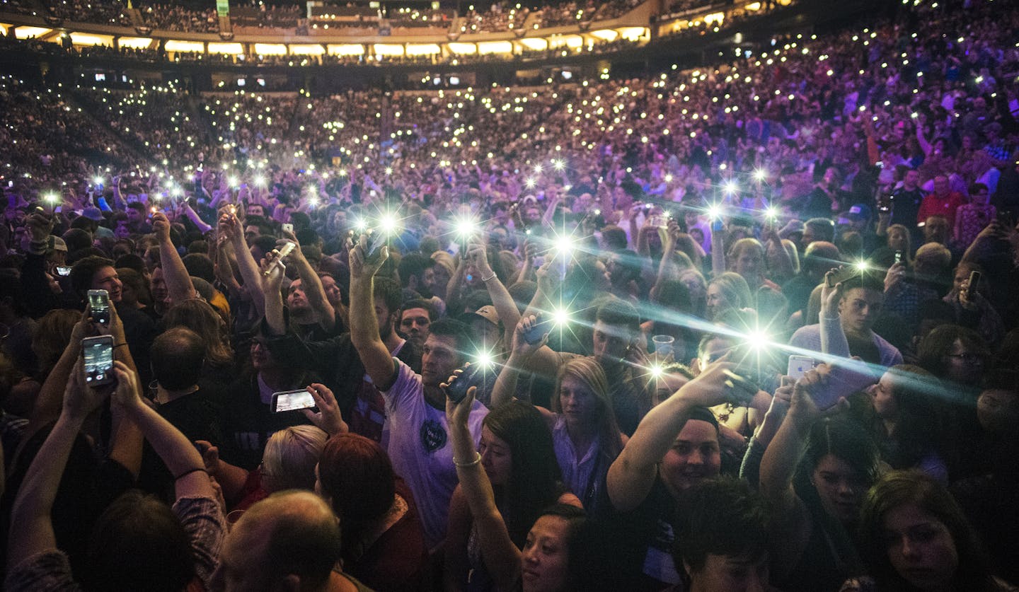 Before Mumford & Sons performed at a nearly sold-out show, the crowd danced to Purple Rain in Prince's honor. The crowd was also bathed in purple light.]At the Xcel Center on April 21, 2016.Richard Tsong-Taatarii/rtsong-taatarii@startribune.com