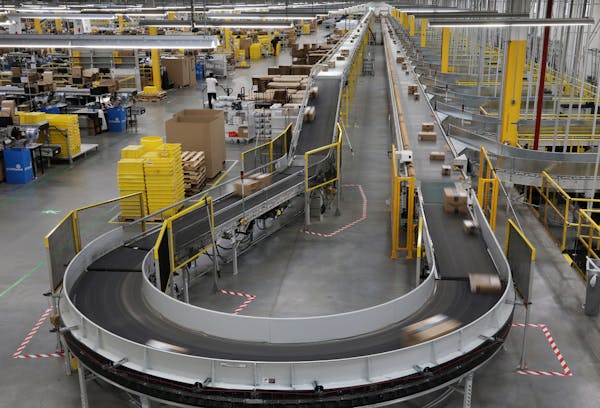 Packages passed down a conveyor bound for delivery trucks at Amazon. ] ANTHONY SOUFFLE &#x2022; anthony.souffle@startribune.com Site managers gave a t