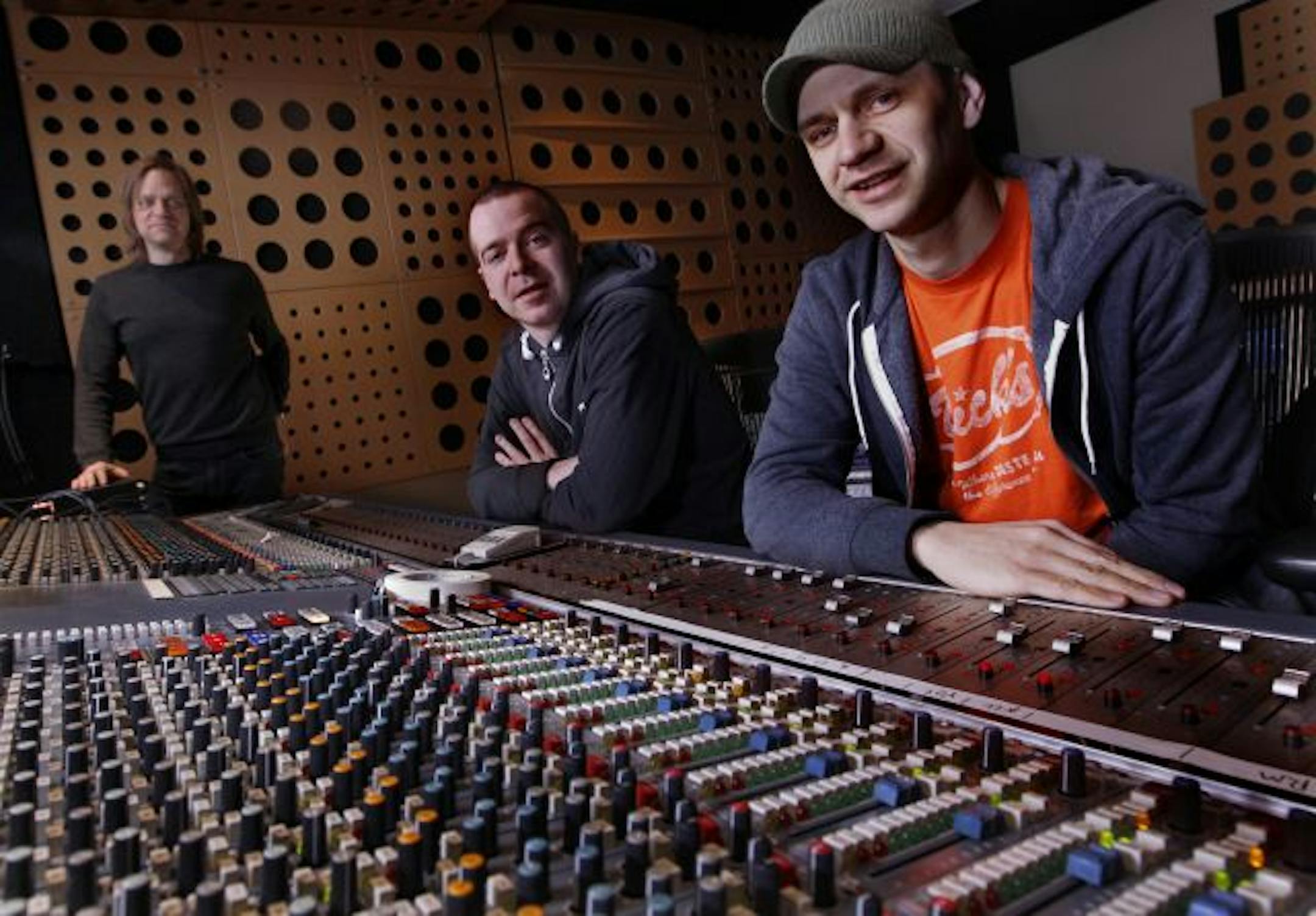 Bill Shaw, center, and James Diers, right, of Halloween, Alaska were able to finish studio work on the band's fourth album, thanks to $5,000 via Kickstarter. At left is Jason Orris, an engineer at the Terrarium.