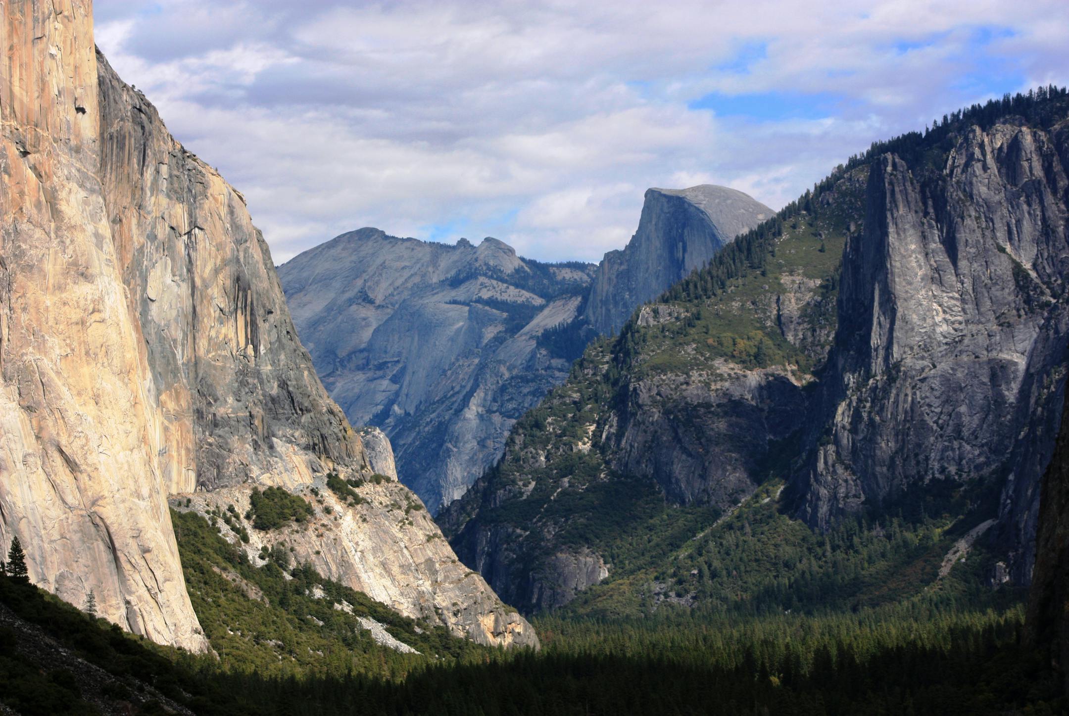 FILE - This Oct. 2, 2013, file photo, shows a view seen on the way to Glacier Point trail in the Yosemite National Park, Calif. Sexual harassment, bullying and other misconduct is rampant among employees at national parks across the country, including at iconic sites such as Yosemite, Yellowstone and the Grand Canyon, a congressional committee was told Sept. 22, 2016. At Yosemite, at least 18 employees have come forward with allegations of harassment or other misconduct so severe that a recent r