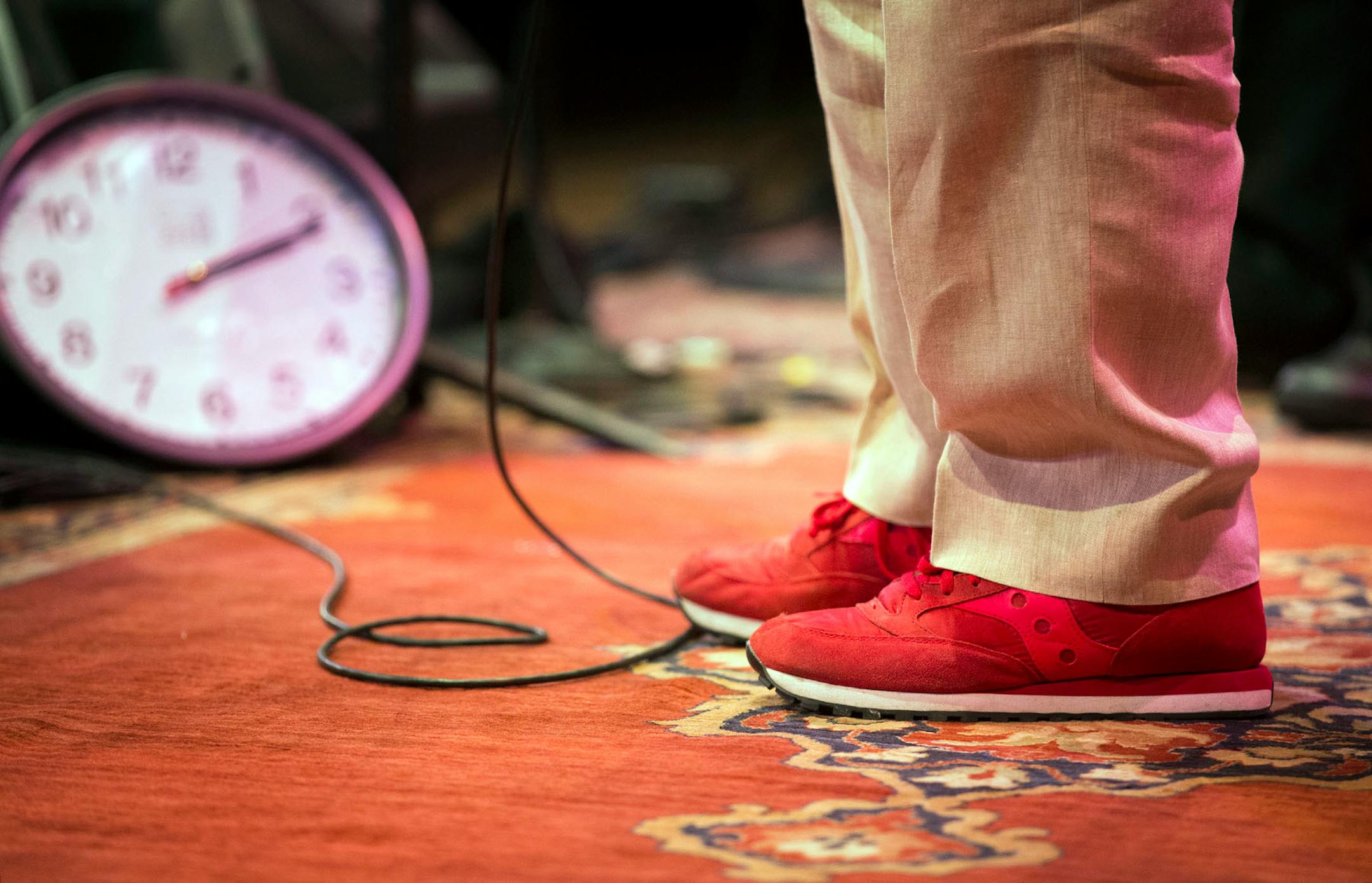 Garrison Keillor rehearses onstage in his trademark red sneakers before a live broadcast from the State Theatre.