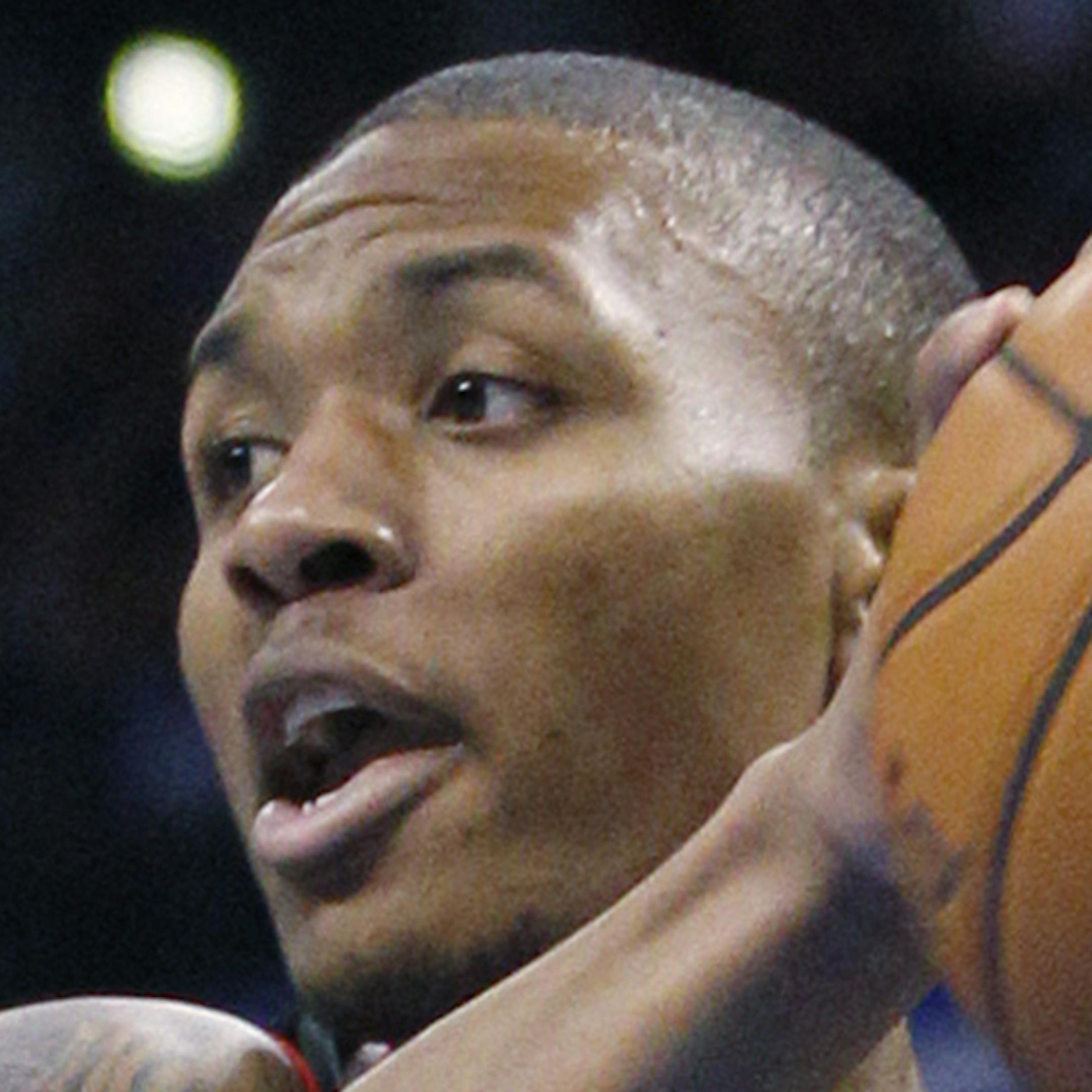 Portland Trail Blazers guard Damian Lillard (0) drives under the basket in front of Oklahoma City Thunder center Kendrick Perkins during the first quarter of an NBA basketball game in Oklahoma City, Friday, Nov. 2, 2012. Oklahoma City won 106-92. (AP Photo/Sue Ogrocki) ORG XMIT: OKSO121