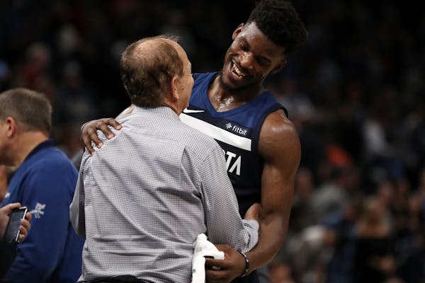 Wolves guard Jimmy Butler was congratulated by owner Glen Taylor on the court following Friday's victory over Oklahoma City.