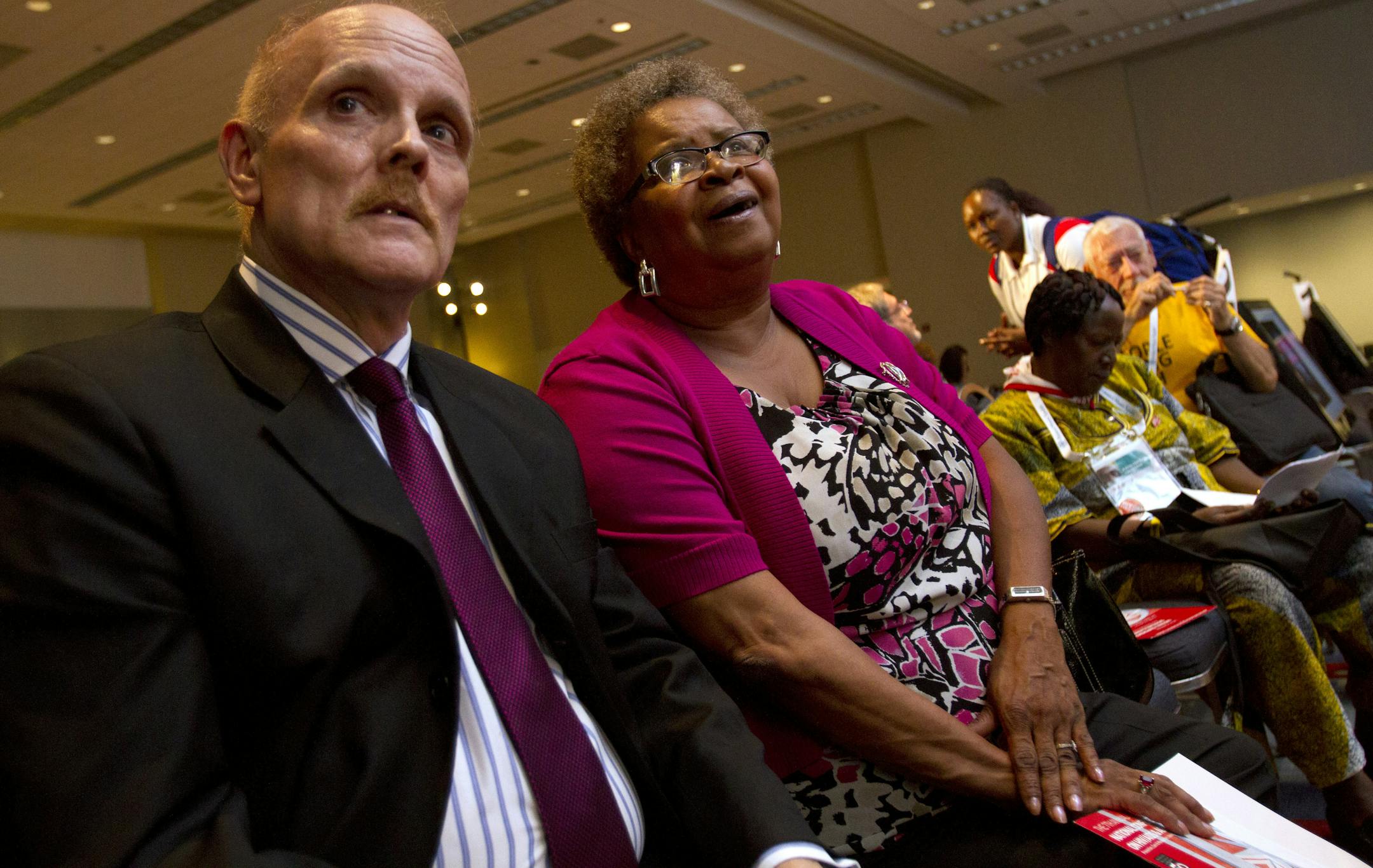 Stephen Karpiak of the AIDS Community Research Initiative of America and Carolyn Massey, 54, of Laurel, Md., waited to speak at the panel, "Aging With HIV," at the International AIDS Conference in Washington.