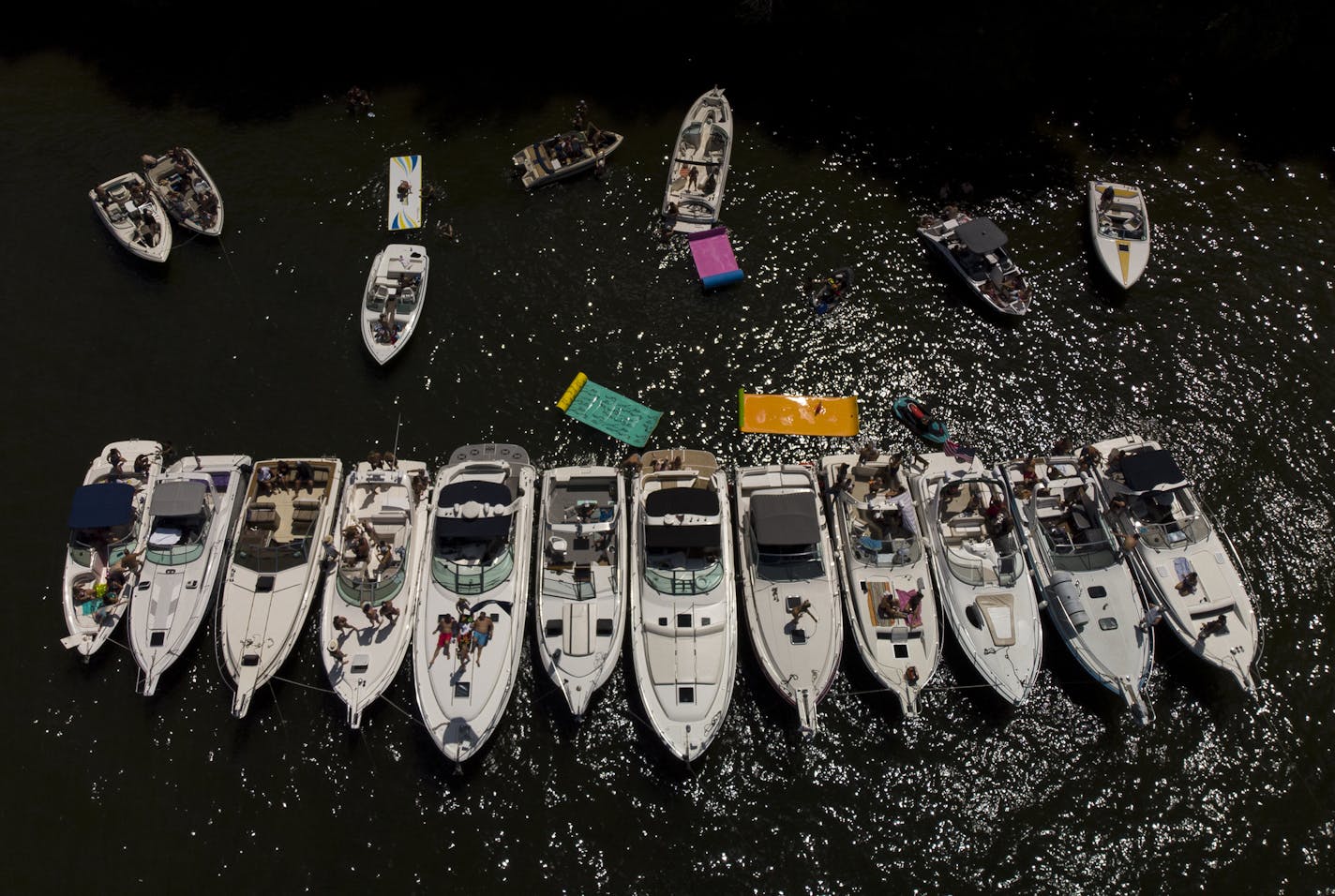 Boats were lined up along Lake Minnetonka's Big Island Saturday afternoon. ] Aaron Lavinsky &#xa5; aaron.lavinsky@startribune.com A "deep dive" on the situation at Minnetonka's Big Island, and what, if anything, has been done to clean it up. We photograph the scene around the Big Island on Saturday, July 27, 2019 on Lake Minnetonka, Minn.