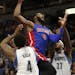 Detroit Pistons center Andre Drummond (0) is fouled by Minnesota Timberwolves forward Jordan Hill (27) in the second half of an NBA basketball game Fr