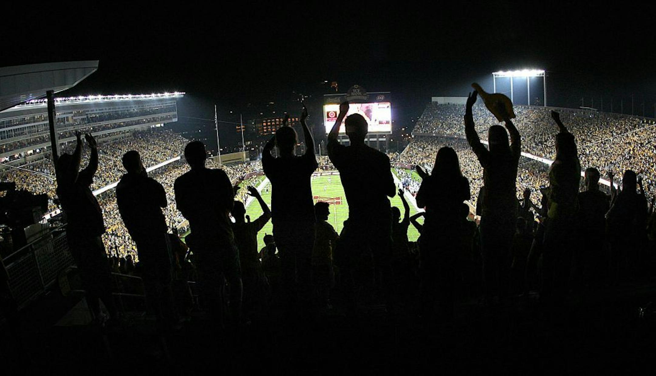 JIM GEHRZ � jgehrz@startribune.com Minneapolis/September 12, 2009/6:30 PM Fans in the student section cheer in the second half in the Gophers victory over Air Force at the new TCG Bank Stadium Saturday night.