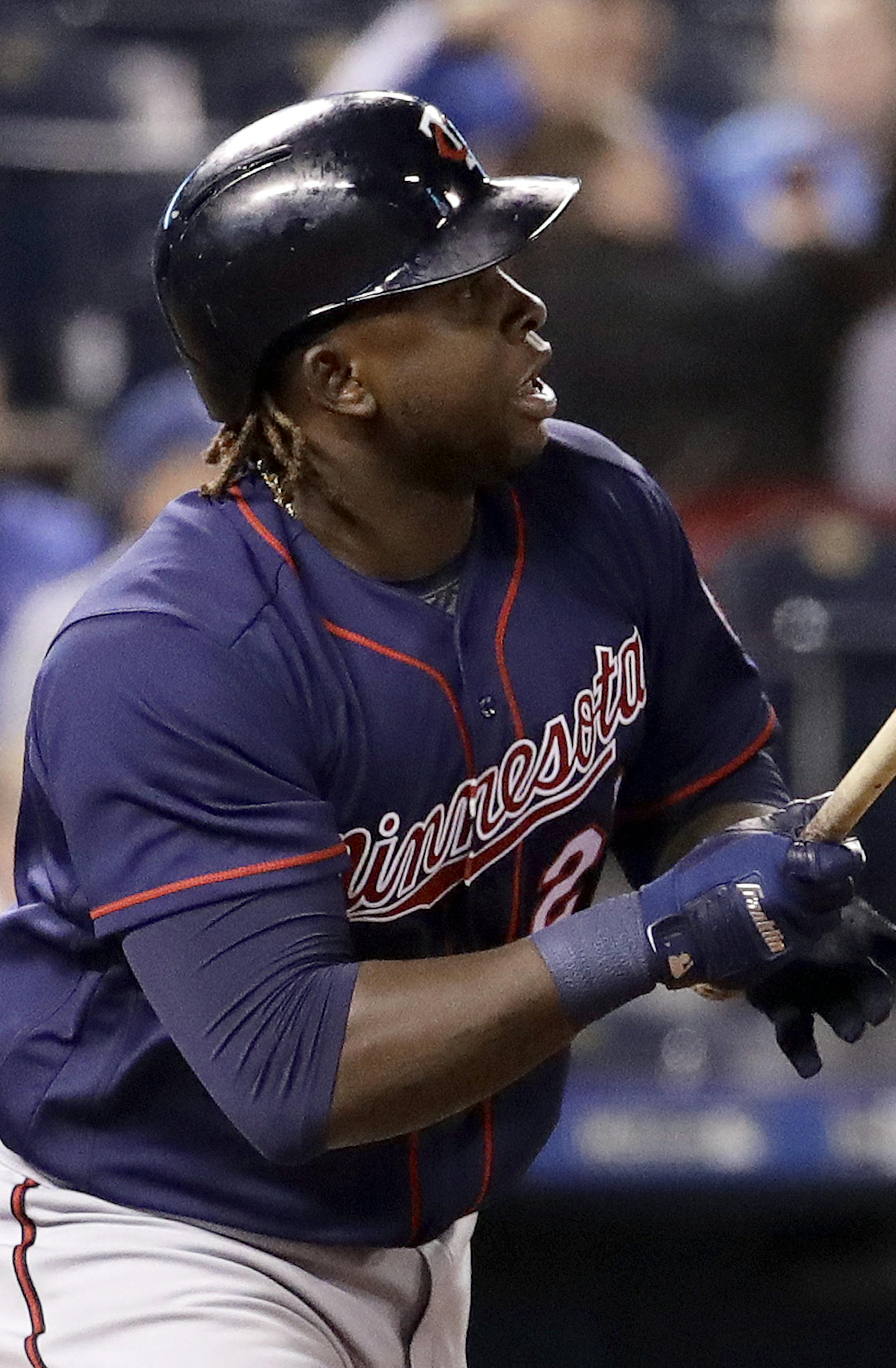 Minnesota Twins' Miguel Sano watches his two-run double during the eighth inning of a baseball game against the Kansas City Royals Friday, April 28, 2017, in Kansas City, Mo. (AP Photo/Charlie Riedel)