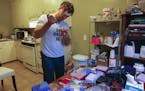 Scientist Josiah Zayner, 34, pipetting solutions for bacterial engineering in his home lab on Dec. 15, 2015 in Burlingame, Calif. (John Green/Bay Area