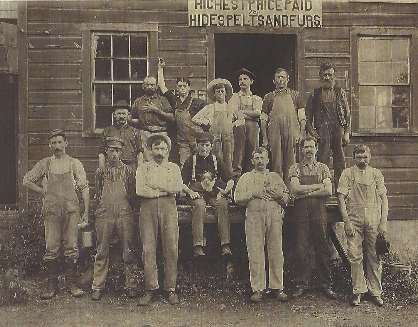 In this 1900-era photo of the Uber family tannery in Hartford, WI, three of the four sons of Carl Gottlieb Uber are shown. First row, fourth from left with the dog is Rudolph Uber. Fifth from left with a cat is Richard Uber; and second row first from left is Charles Uber. The fourth brother, Adolph Uber, left the family for Owatonna to start his own tannery, which exists yet today as the nation's only remaining custom tannery.