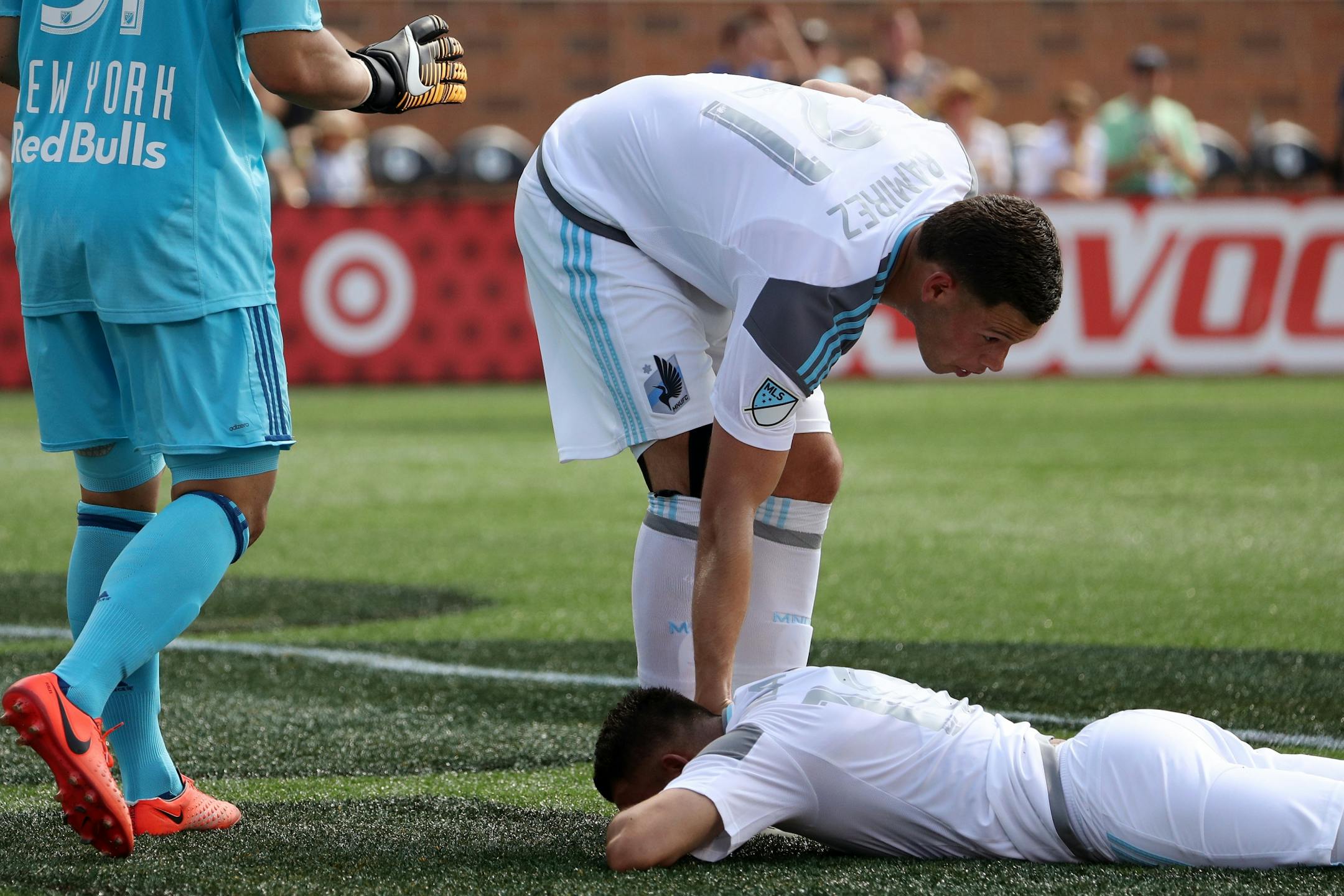 Minnesota United forward Christian Ramirez (21) tried to encourage his teammate Minnesota United midfielder Miguel Ibarra (10) after he shot wide on New York Red Bulls goalkeeper Luis Robles (31) in the first half.