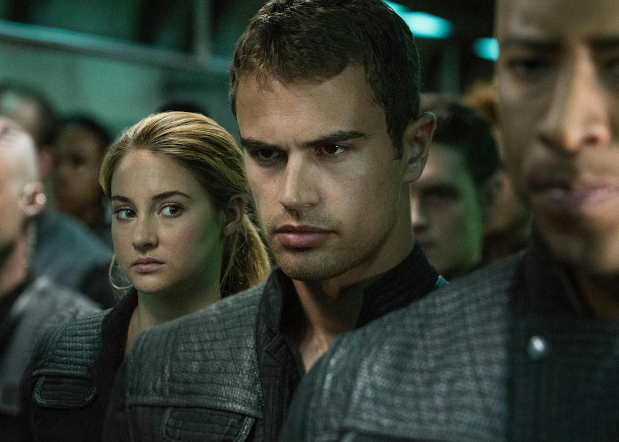 This image released by Summit Entertainment shows Shailene Woodley, left, and Theo James in a scene from "Divergent." (AP Photo/Summit Entertainment, Jaap Buitendijk) ORG XMIT: NYET541