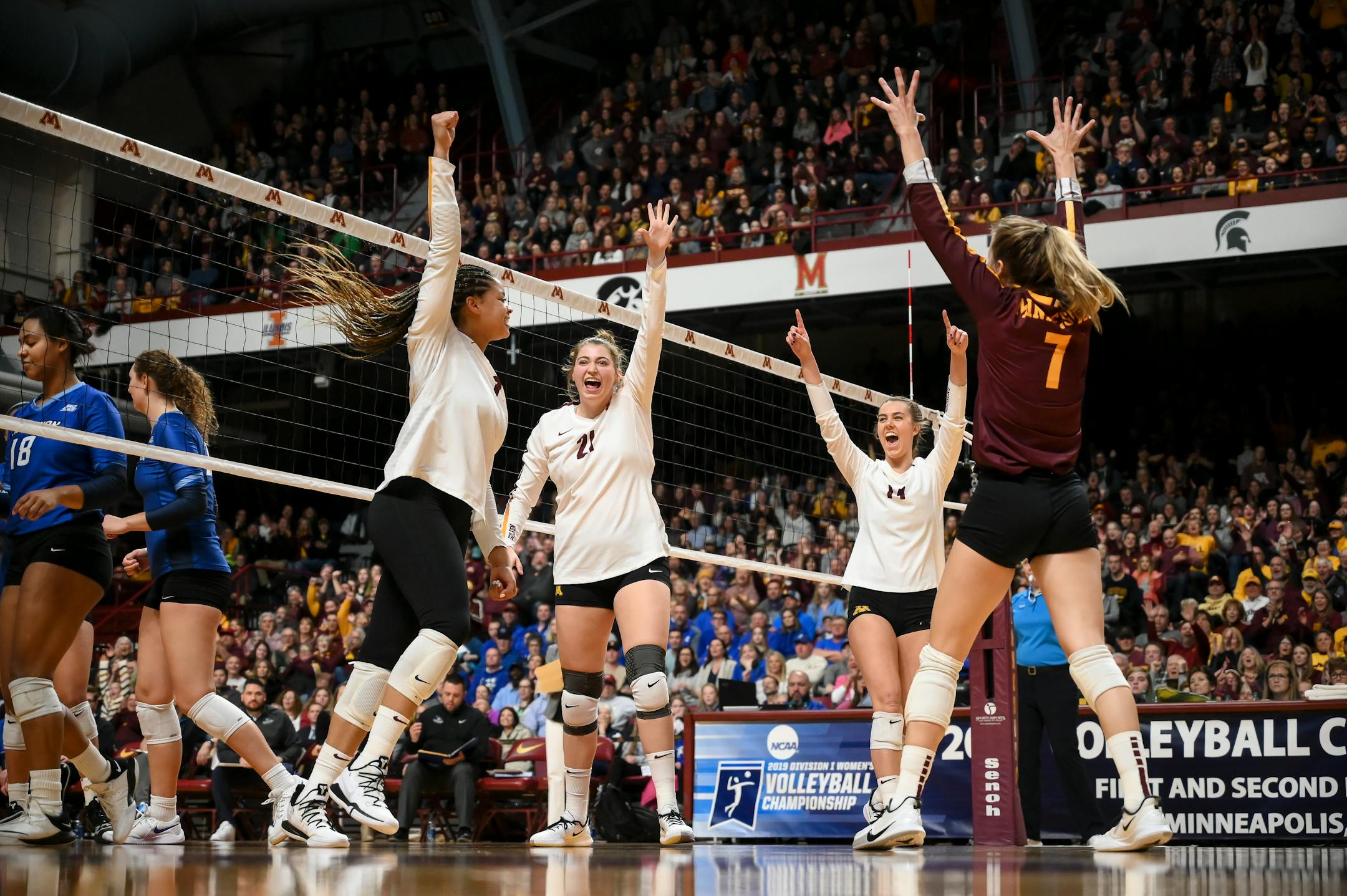 Minnesota players celebrated a point during a tournament match in 2019.