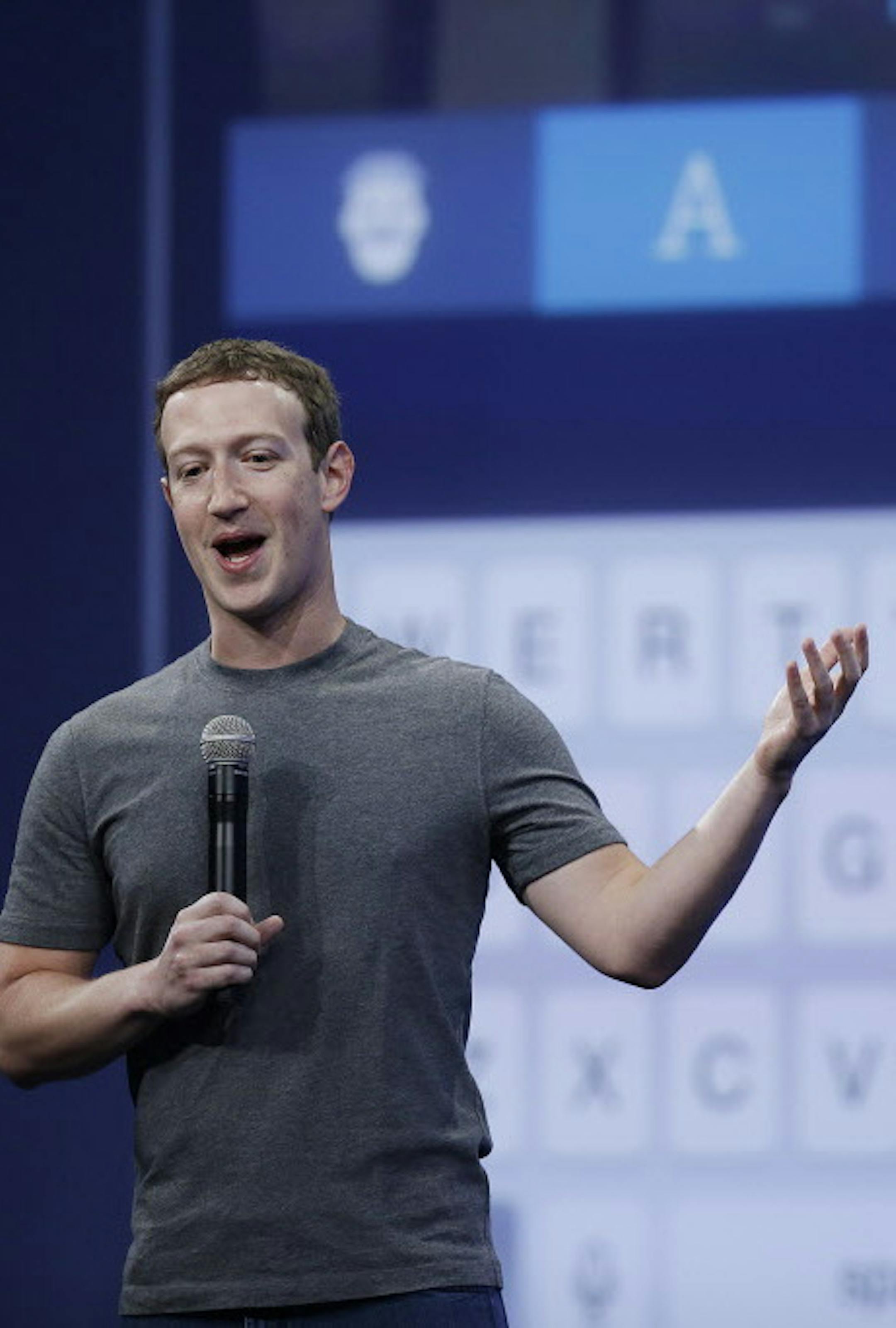 CEO Mark Zuckerberg talks about the Messenger app during the Facebook F8 Developer Conference Wednesday, March 25, 2015, in San Francisco. Facebook is trying to mold its Messenger app into a more versatile communications channel as smartphones create new ways for people to connect with friends and businesses beyond the walls of the company's ubiquitous social network. (AP Photo/Eric Risberg)