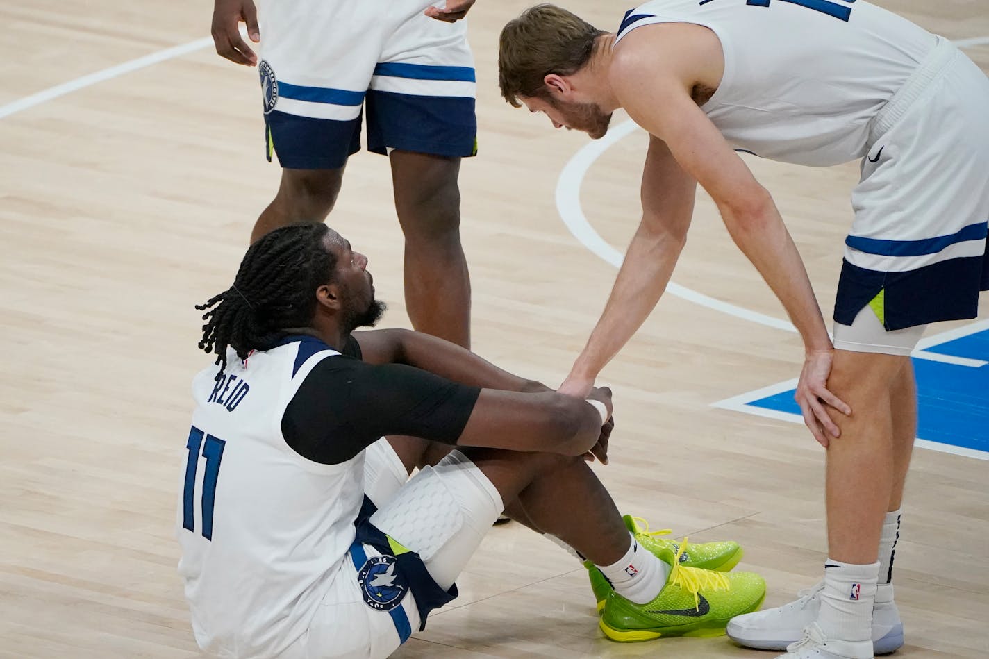 Timberwolves center Naz Reid sits on the court after the Thunder defeated the Wolves in a game full of dominating runs.