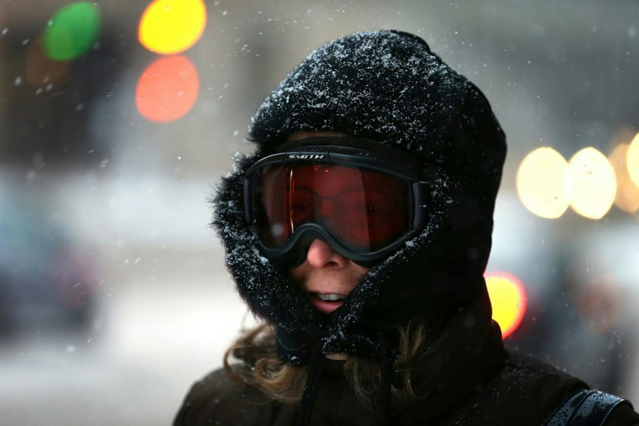 Teresa Goodson walks to work in ski goggles during the first snowstorm of the season on Monday, Nov. 10, 2014 in St. Paul, Minn. Though the snow will largely stop in Minnesota by Tuesday afternoon, said Joe Calderone, senior forecaster at the National Weather Service office in Chanhassen, Minn., the state won�t be �seeing any warm up any time soon.�