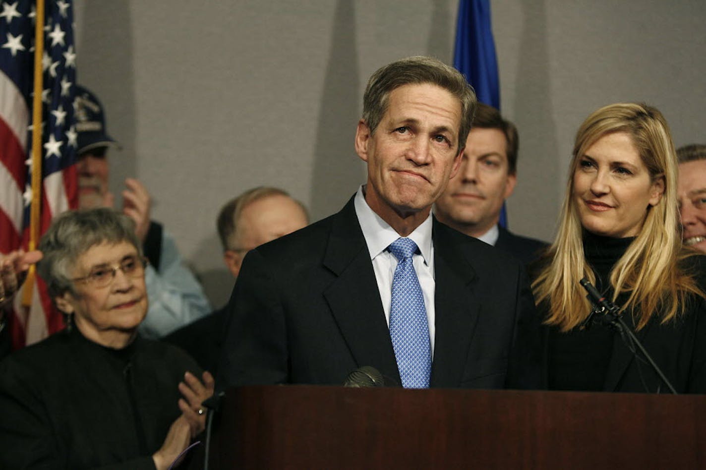 With his wife, Laurie, and supporters next to him, Norm Coleman announced that he would challenge the Senate recount in court.