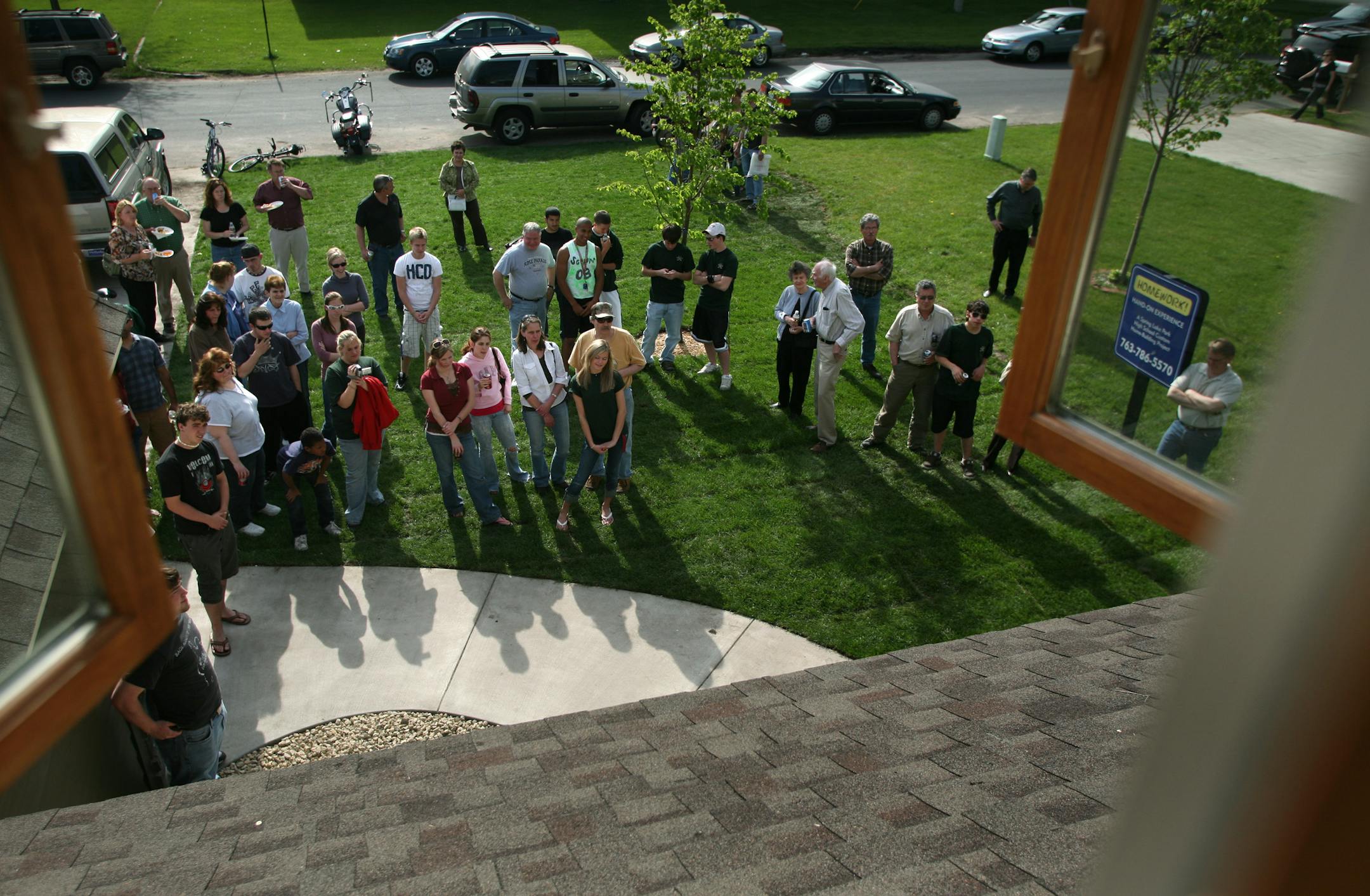 The 51 Spring Lake Park juniors and seniors who worked on the house at 8927 Pierce St. in Blaine gathered Wednesday on the lawn with families, friends and school staff for a short awards presentation during an open house and picnic. The students in the Construction Trades Program built the house in two years.