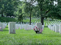 American flags commemorating Memorial Day fly at the grave sites of service members buried at Arlington National Cemetery on May 23.