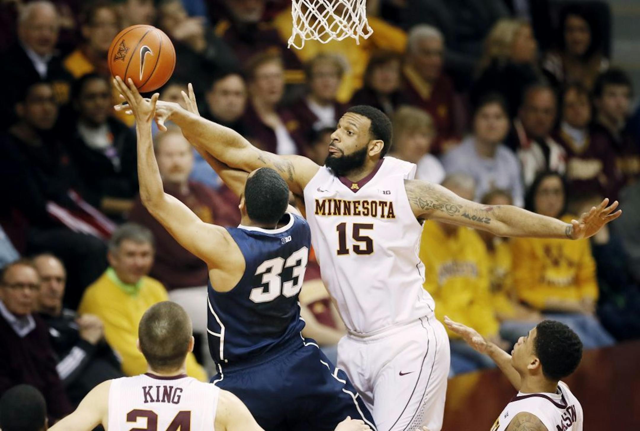 Gophers center Mo Walker (15) fouled Penn State's Shep Garner in the fist half.