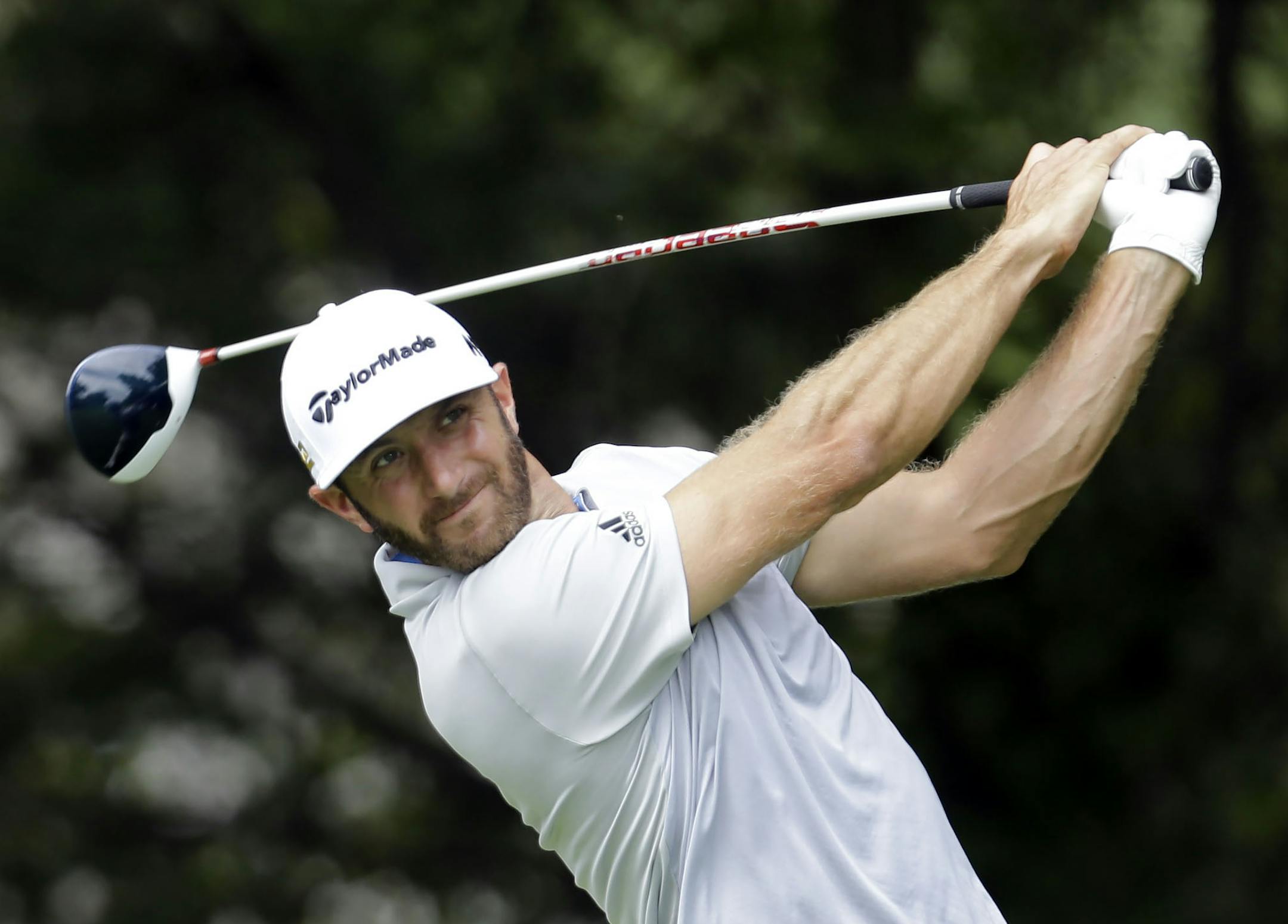 Dustin Johnson watches his drive off the tee on the fifth hole during the second round of the BMW Championship golf tournament at Crooked Stick Golf Club in Carmel, Ind., Friday, Sept. 9, 2016. (AP Photo/AJ Mast)