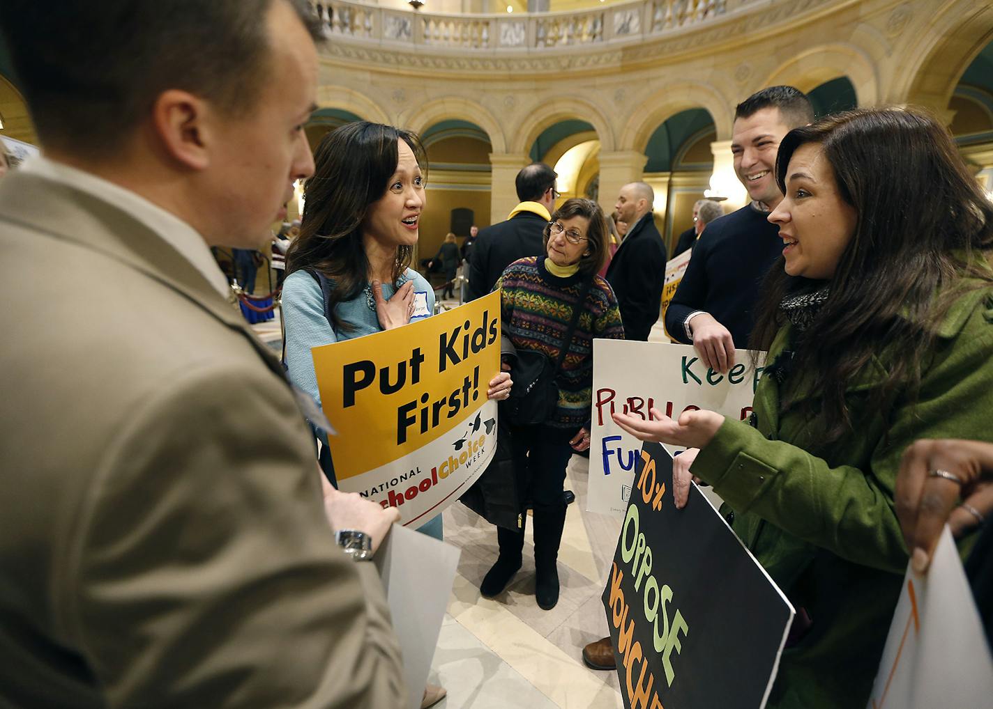 Nighi Anderson, left, and Nicole Blissenbach, right, debated their education stances after a Minnesota School Choice Day Rally at the State Capitol Rotunda, Tuesday, January 24, 2017 in St. Paul, MN. ] (ELIZABETH FLORES/STAR TRIBUNE) ELIZABETH FLORES &#x2022; eflores@startribune.com