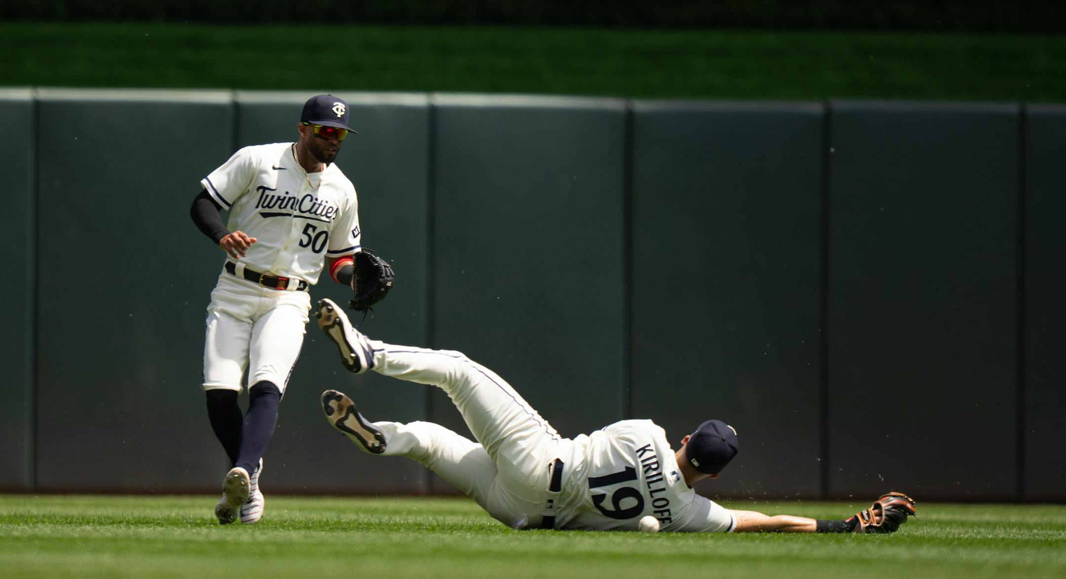 Minnesota Twins left fielder Alex Kirilloff (19) couldn't make the catch on a Toronto Blue Jays catcher Alejandro Kirk (30) fly ball in the second inning, allowing to RBI's. He was backed up by Twins center fielder Willi Castro (50).