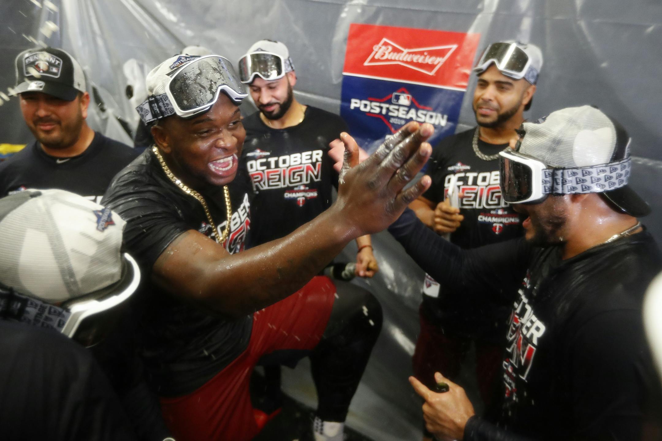 Minnesota Twins' Miguel Sano celebrates with teammates after the Twins clinched the AL Central, Wednesday, Sept. 25, 2019, in Detroit. The Twins defeated the Detroit Tigers 5-1, and later clinched when the Cleveland Indians lost to the Chicago White Sox.
