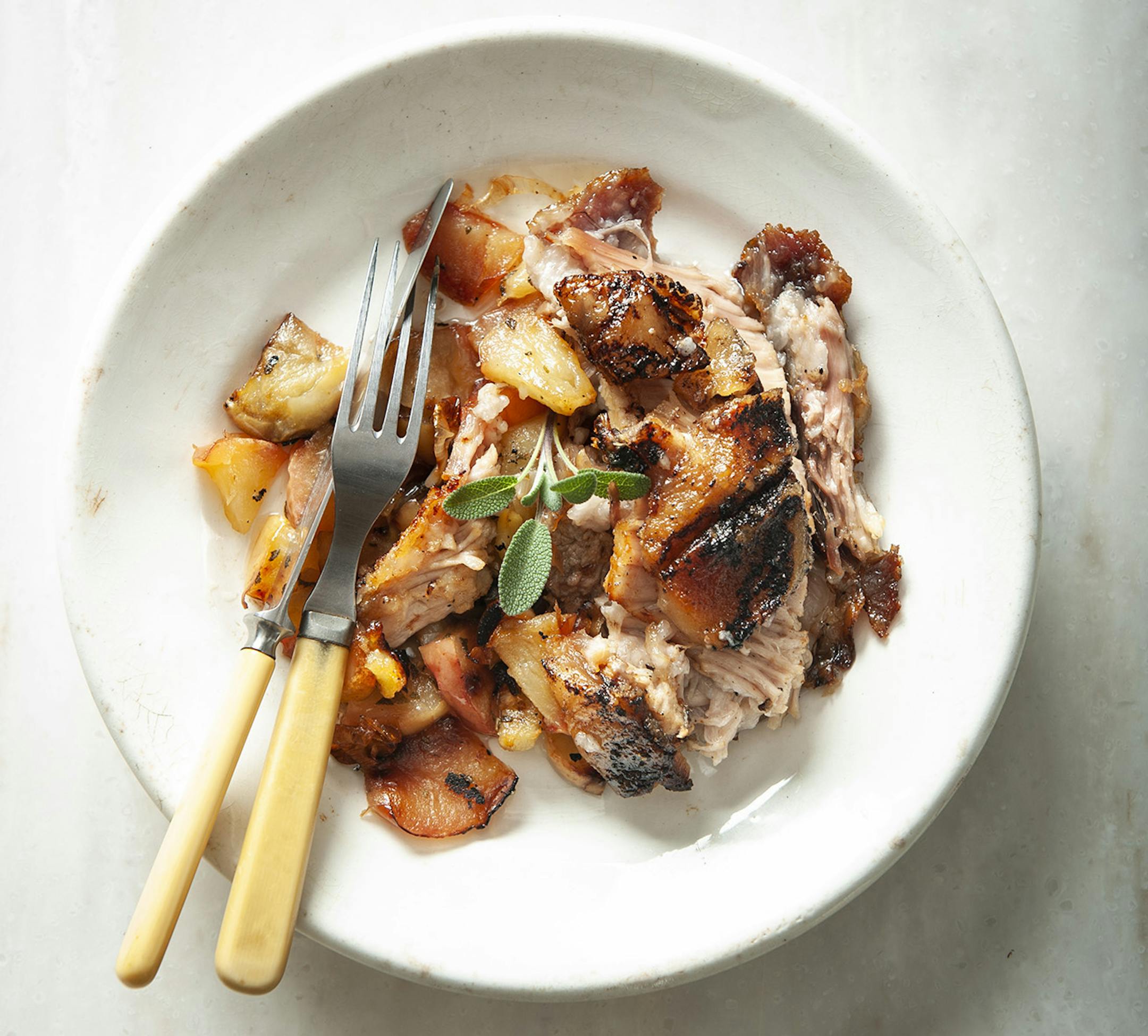 Slow-Roasted Pork Belly With Leeks and Apples.
