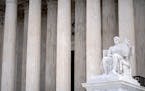 The Guardian of Law scuplture is seen at the west entrance of the Supreme Court on Thursday, Feb. 22, 2024, in Washington. (AP Photo/Mark Schiefelbein