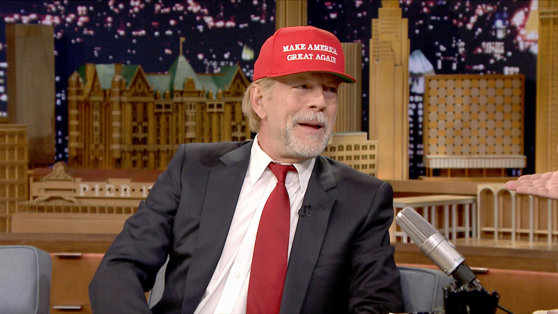 Bruce Willis appears on "The Tonight Show" with Donald Trump-like hair and cap.