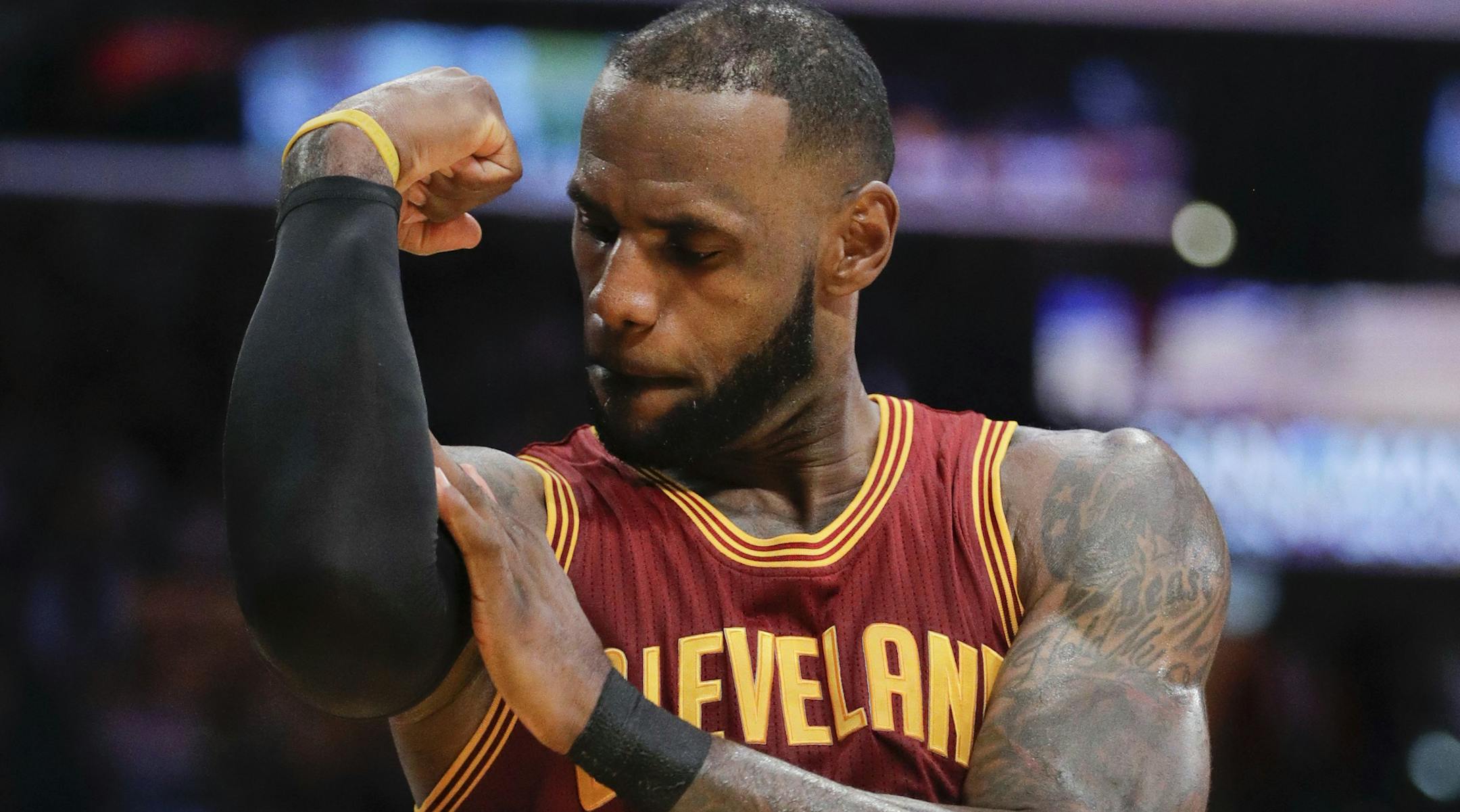 FLE - In this March 19, 2017, file photo, Cleveland Cavaliers' LeBron James flexes his arm after making a basket and drawing a foul call against the Los Angeles Lakers during the second half of an NBA basketball game in Los Angeles. The superstar declined his $35.6 million contract option on Friday, June 29, 2018, with Cleveland and will become a free agent. The four-time MVP could re-sign with his hometown Cavaliers, or go in a completely direction. What he decides in the next few days could re