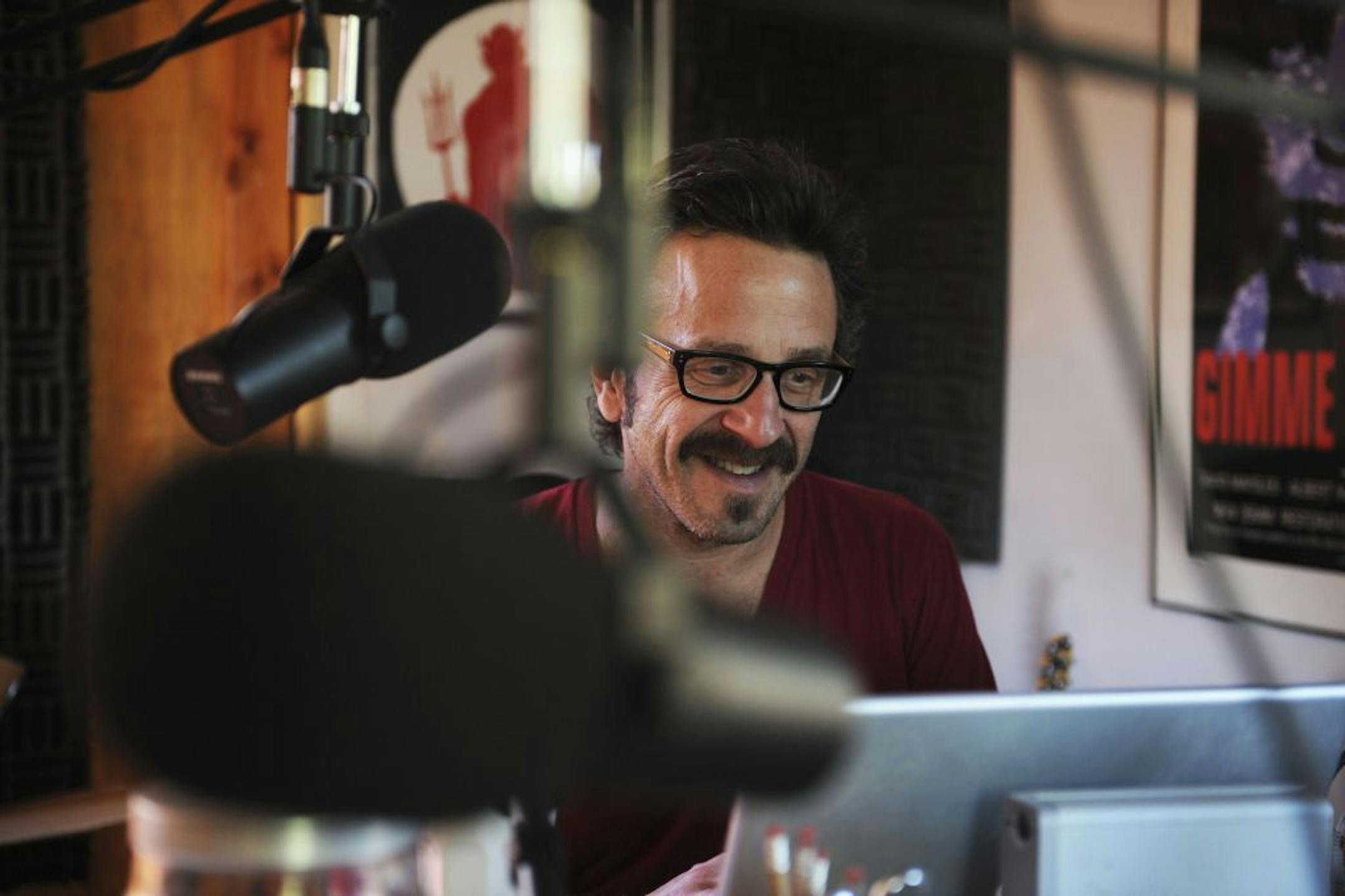 Marc Maron, a comedian, records his podcast in his garage in Los Angeles, on Dec. 12, 2010. Maron runs a cult-hit podcast, on which he gets other comedians to reveal surprising details from their lives. (Robert Yager/The New York Times) -- PHOTO MOVED IN ADVANCE AND NOT FOR USE - ONLINE OR IN PRINT - BEFORE JAN. 9, 2011.