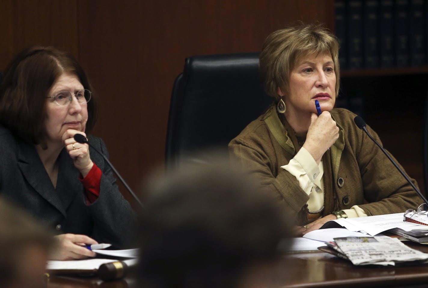 Minnesota Senator Kathy Sheran, right, and House member Tina Liebling, left, of the House Health and Human Services Policy Committee and Senate Health, Human Services and Housing Committee listened in during a review of the Board of Nursing's licensing and disciplinary processes Wednesday, Nov. 13, 2013