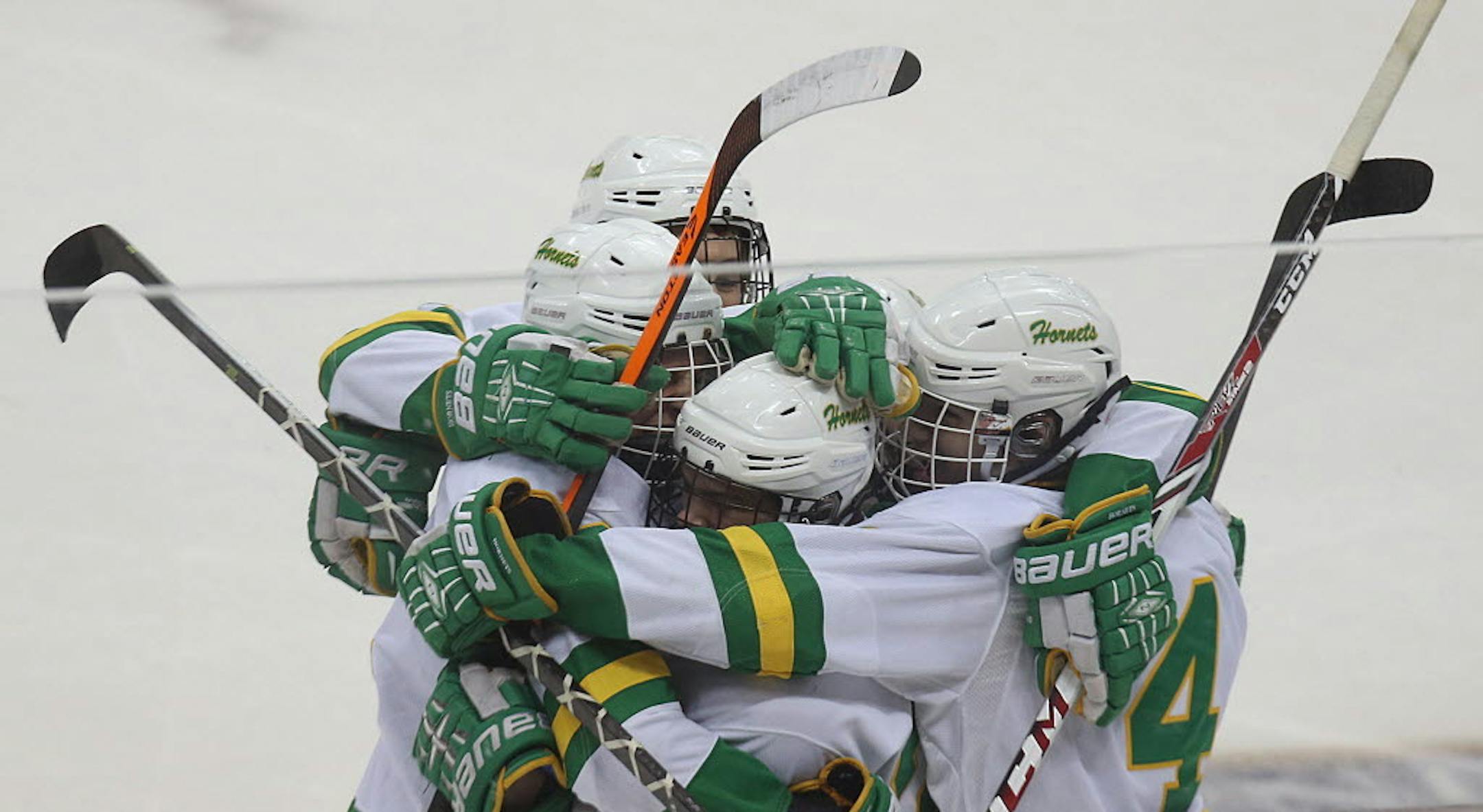 Edina players celebrated Dylan Malmquist's first period goal Friday vs. Eagan in the Class 2A semifinals in St. Paul.
