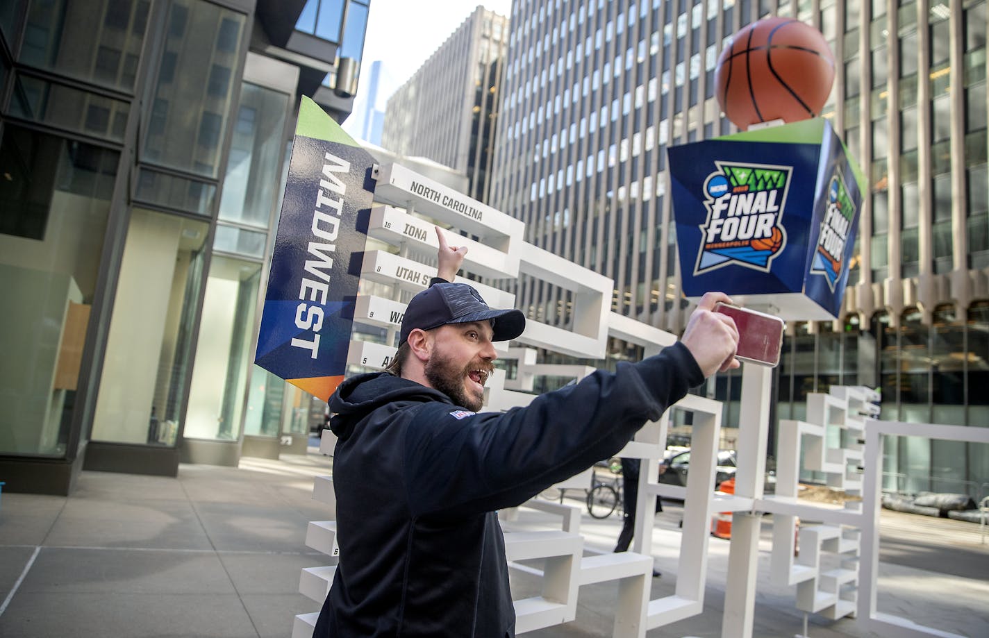 Brad Hardin, took a selfie in front of a 3-D sculpture of the Final Four bracket on the Nicollet Mall in Minneapolis. The crowd downtown will be larger next month for the games and surrounding events.