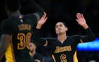 Lakers guard Jordan Clarkson, right, celebrated with forward Julius Randle after scoring against the Timnberwolves on Friday. Clarkson scored 35 point