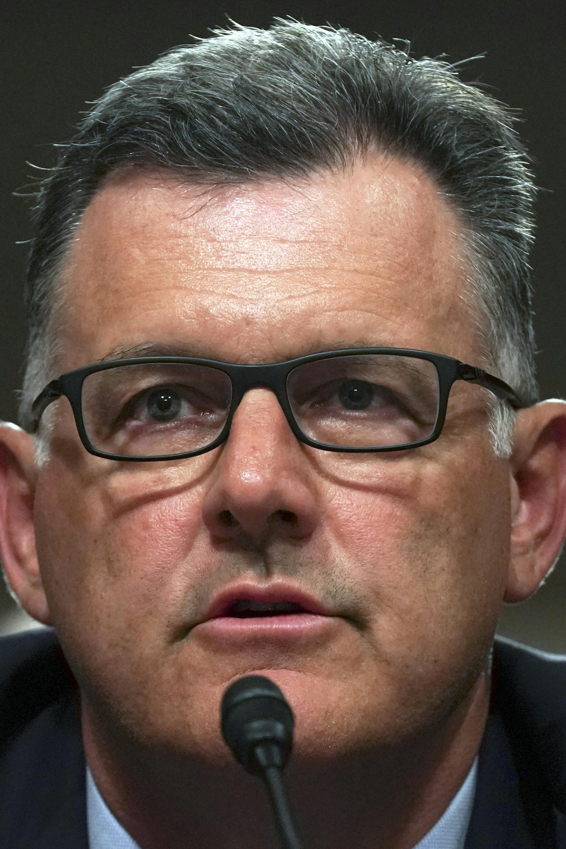 FILE - In this Tuesday, June 5, 2018, file photo, former USA Gymnastics president Steve Penny invokes his right under the Fifth Amendment not to answer questions during a Senate Subcommittee on Consumer Protection, Product Safety, Insurance, and Data Security, on Capitol Hill in Washington. In a statement late Wednesday, Oct. 17, 2018, the Walker County district attorney's office in Huntsville, Texas, said that Penny has been arrested after a Texas grand jury indicted him, alleging he tampered w